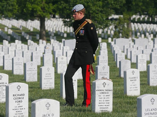 Prince Harry visits Arlington National Cemetery, where war veterans are buried