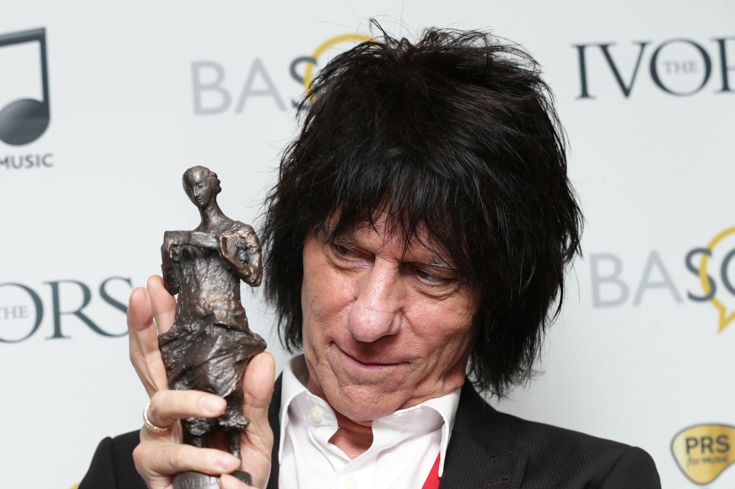 Jeff Beck with his Outstanding Contribution to British Music award, at the 59th annual Ivor Novello Awards, at Grosvenor House, London.