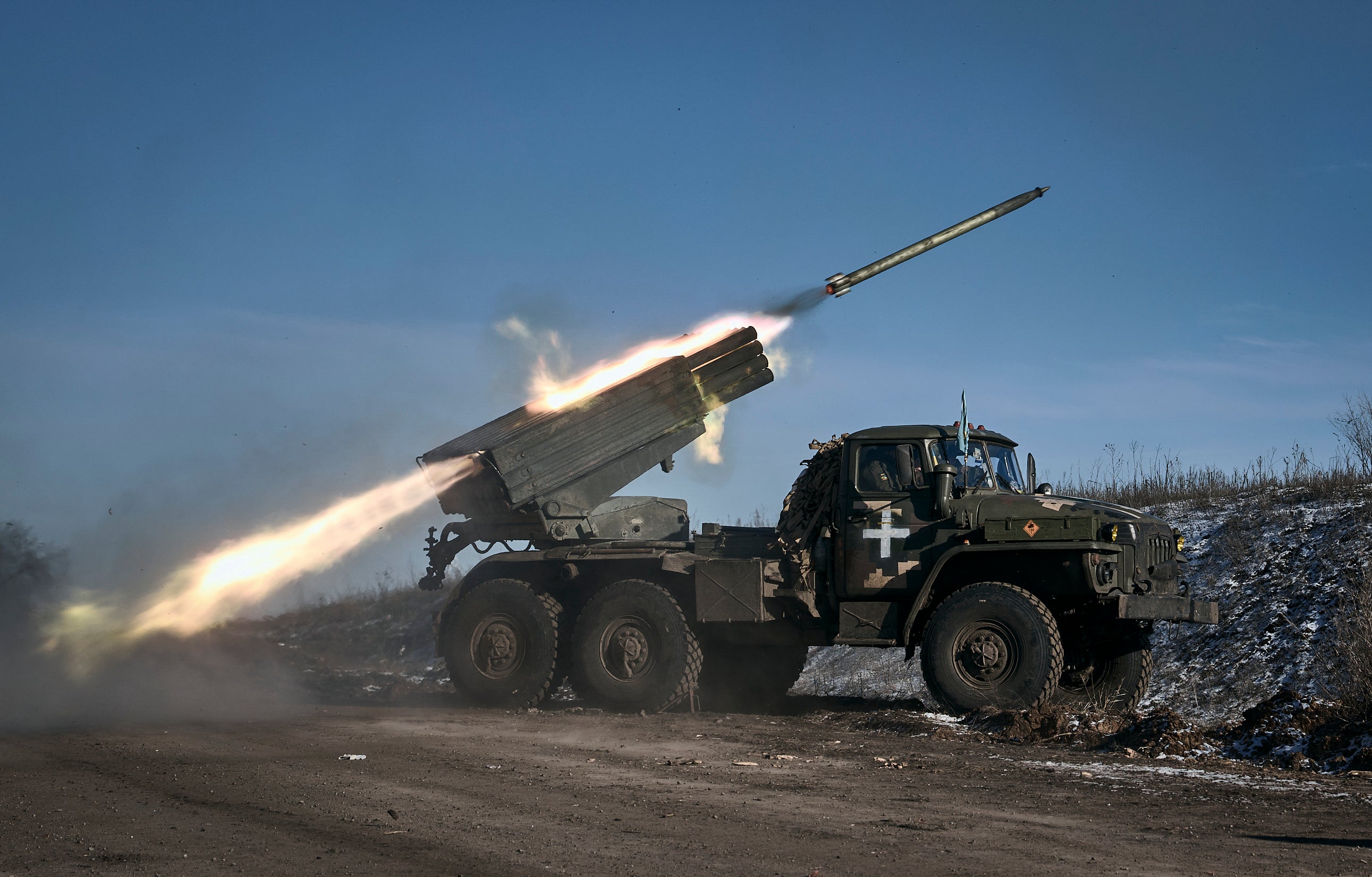 A Ukrainian army Grad multiple rocket launcher fires rockets at Russian positions along the frontline near Soledar