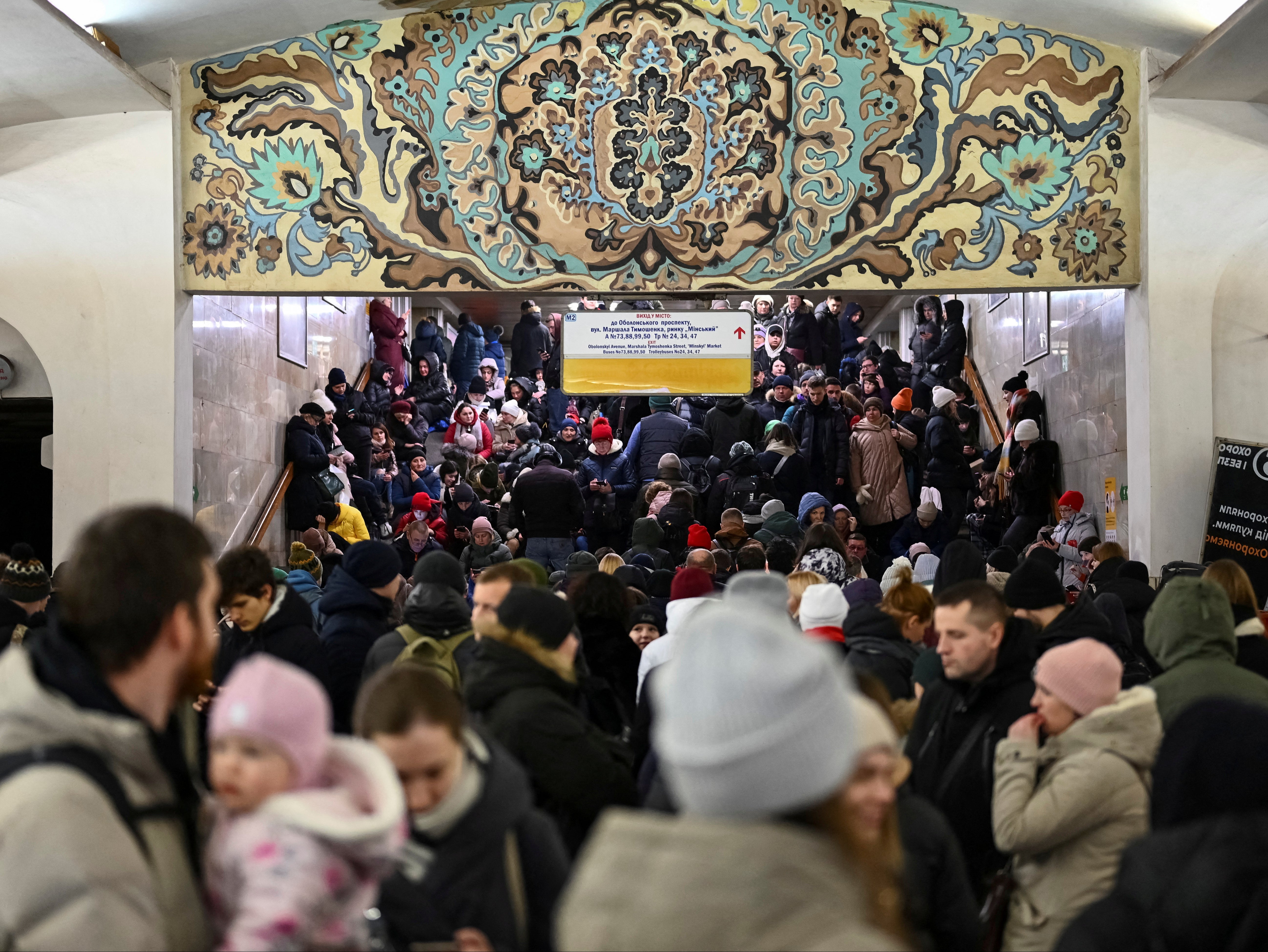 People shelter in a metro station during Russian missile attacks in Kyiv