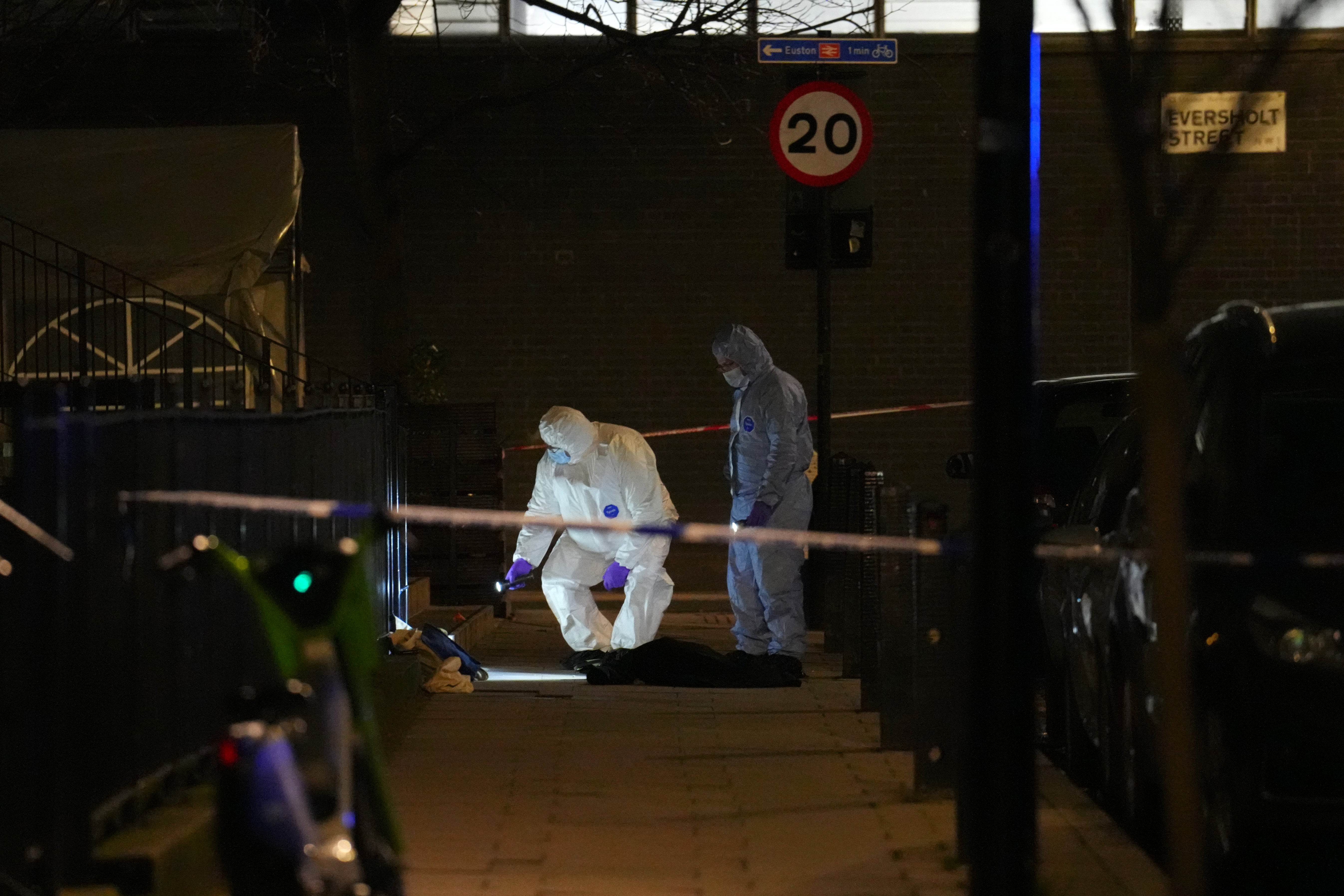 Cordons remain in place as police examine the scene