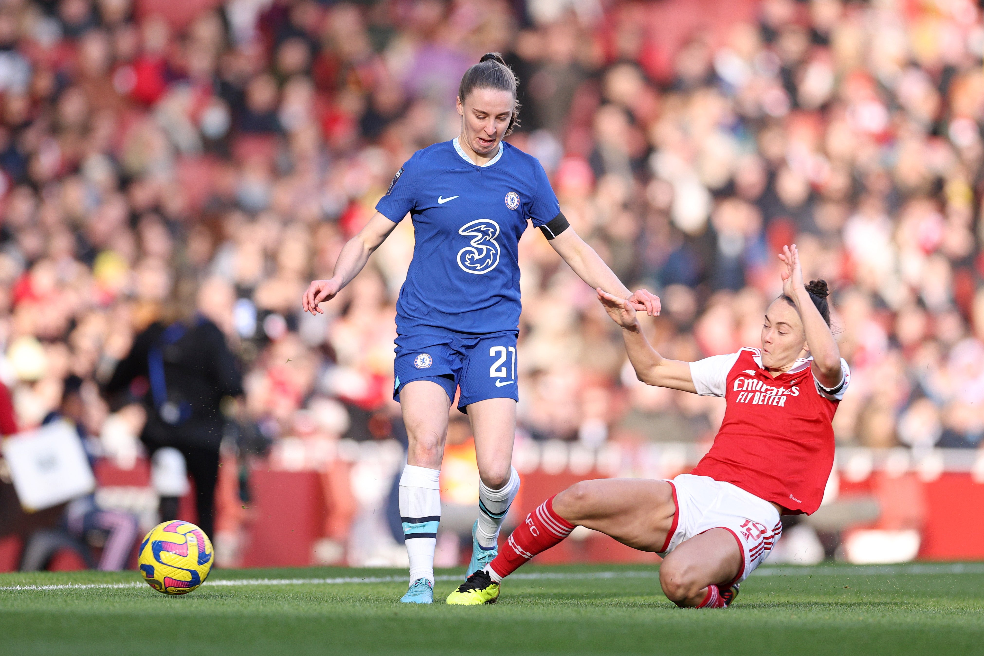 Niamh Charles of Chelsea is tackled by Arsenal’s Caitlin Foord during the WSL match