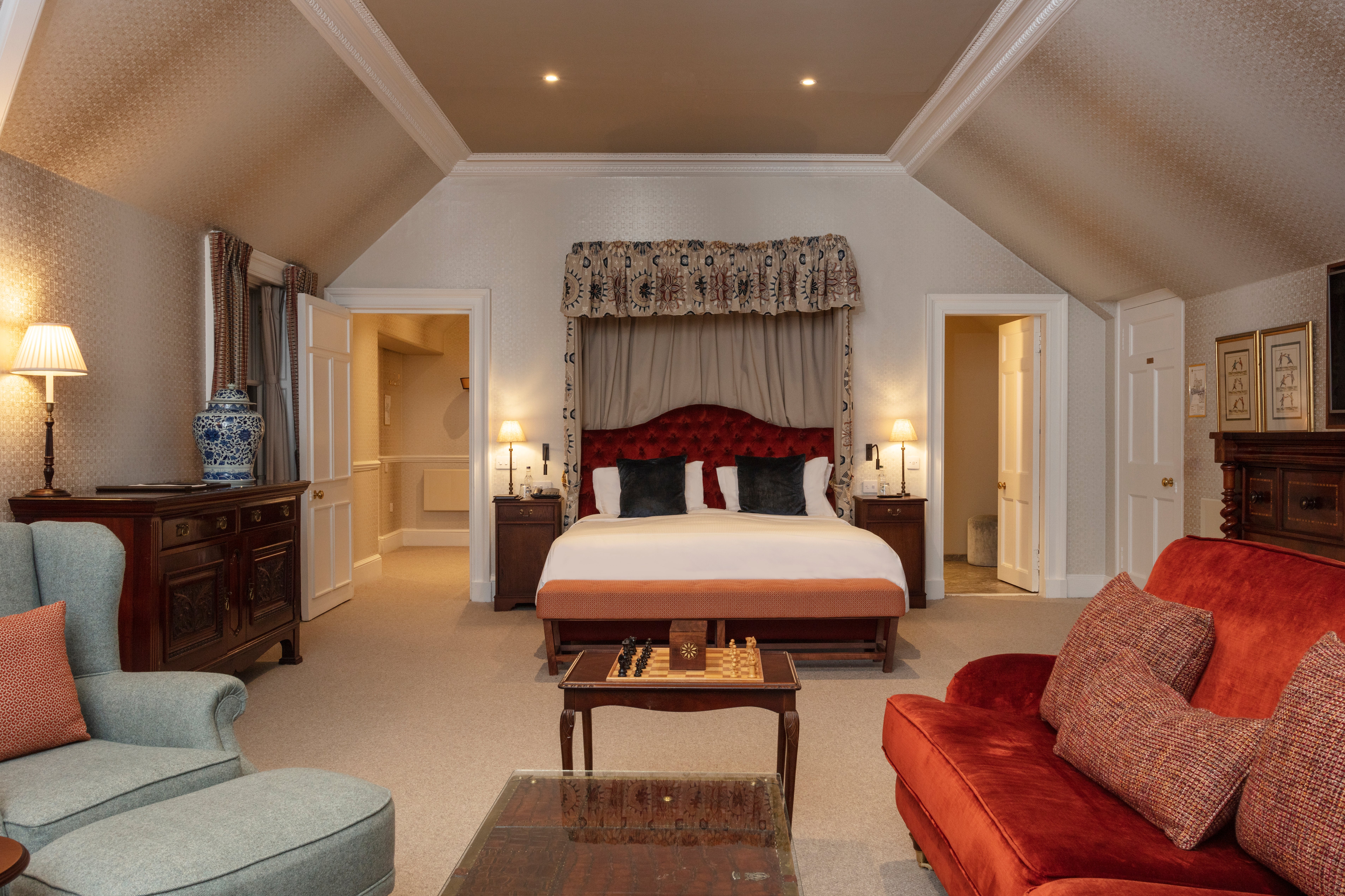 Contemporay with opulent colours and four-poster beds