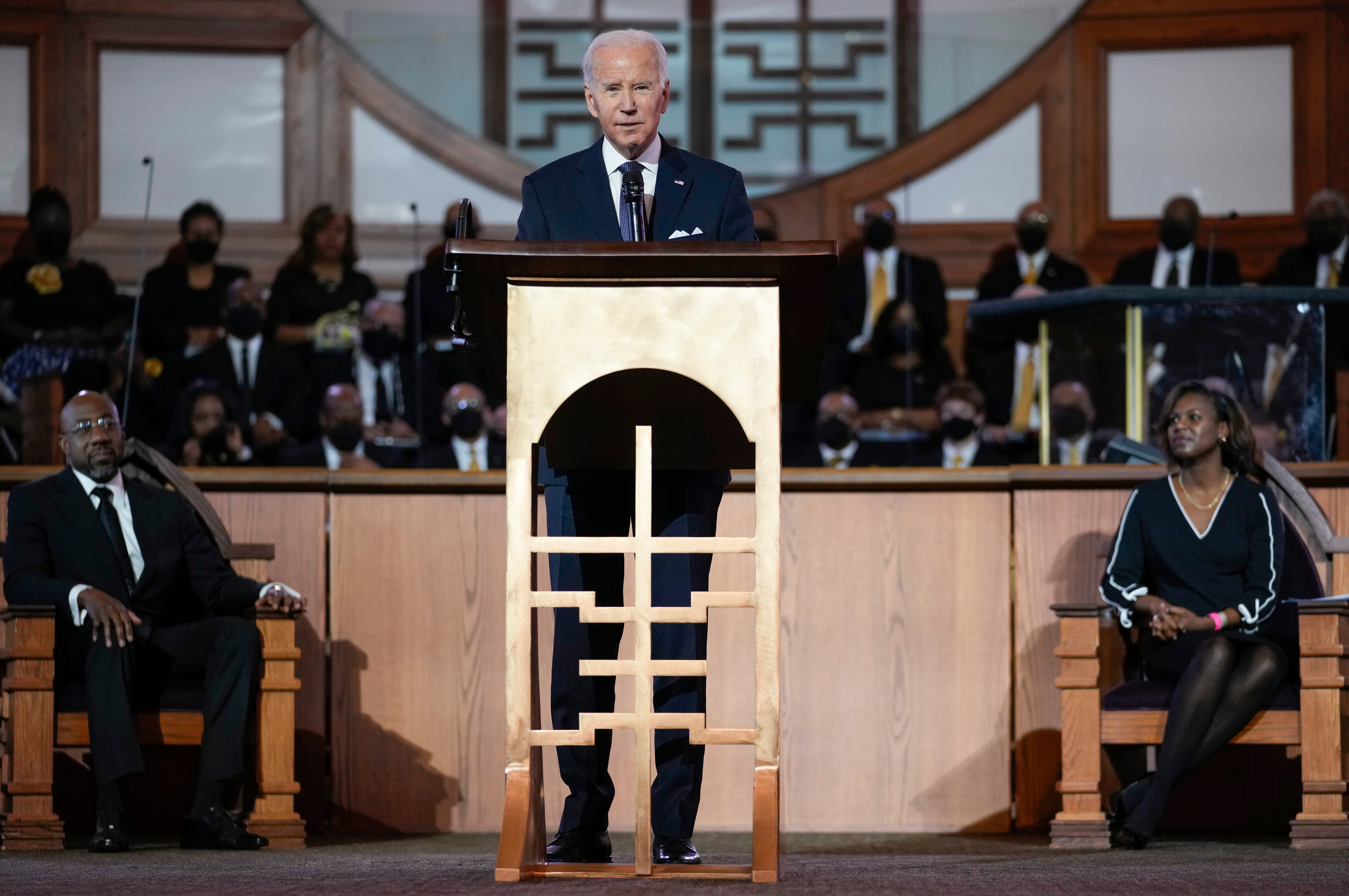 President Joe Biden, joined by Senator Raphael Warnock and Rev Chelsea D Waite, speaks at Ebenezer Baptist Church in Atlanta on 15 January