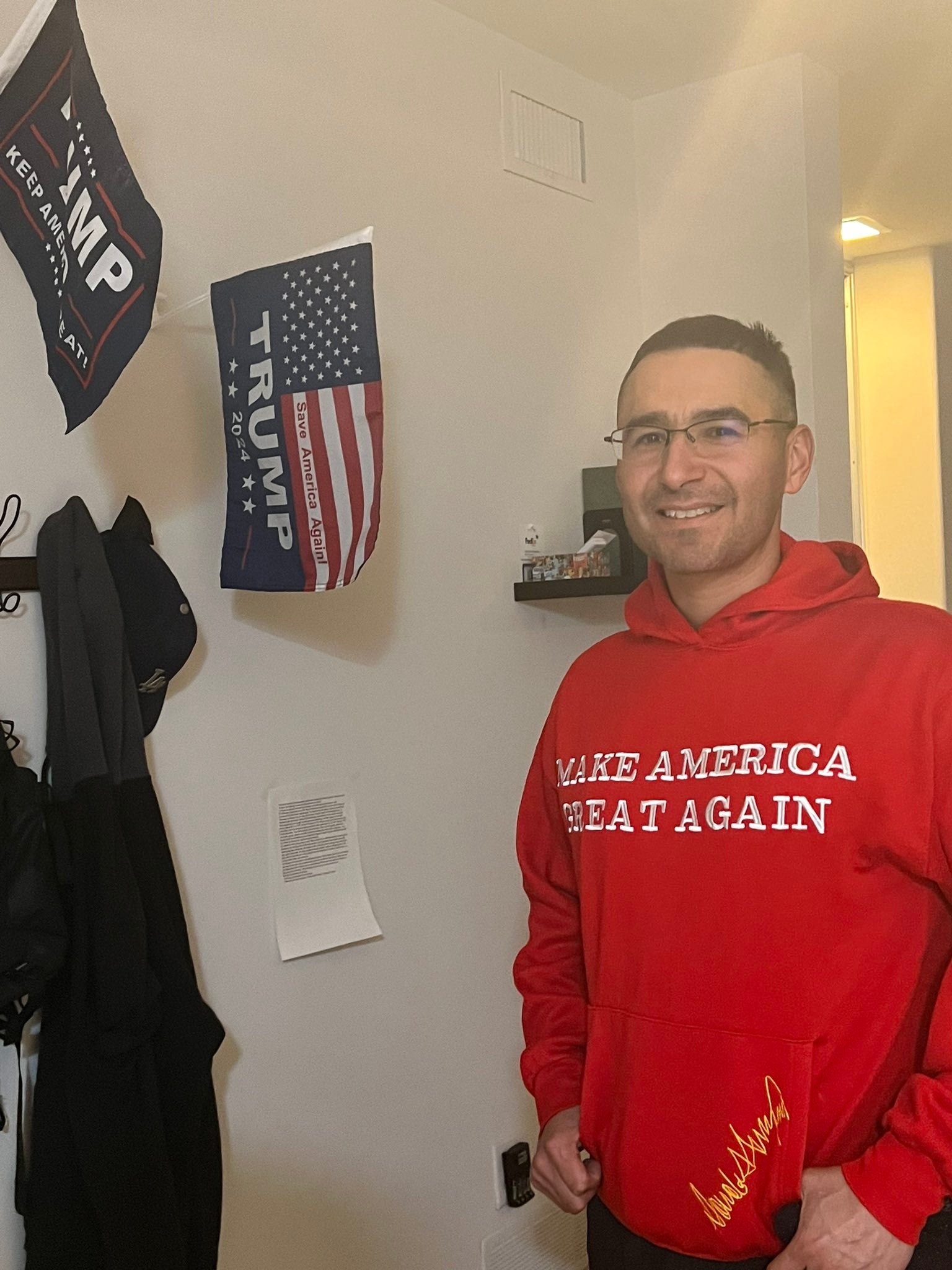 Solomon Peña in what appears to be a Maga sweatshirt signed by Donald Trump. He vowed he would never accept the results of his election defeat