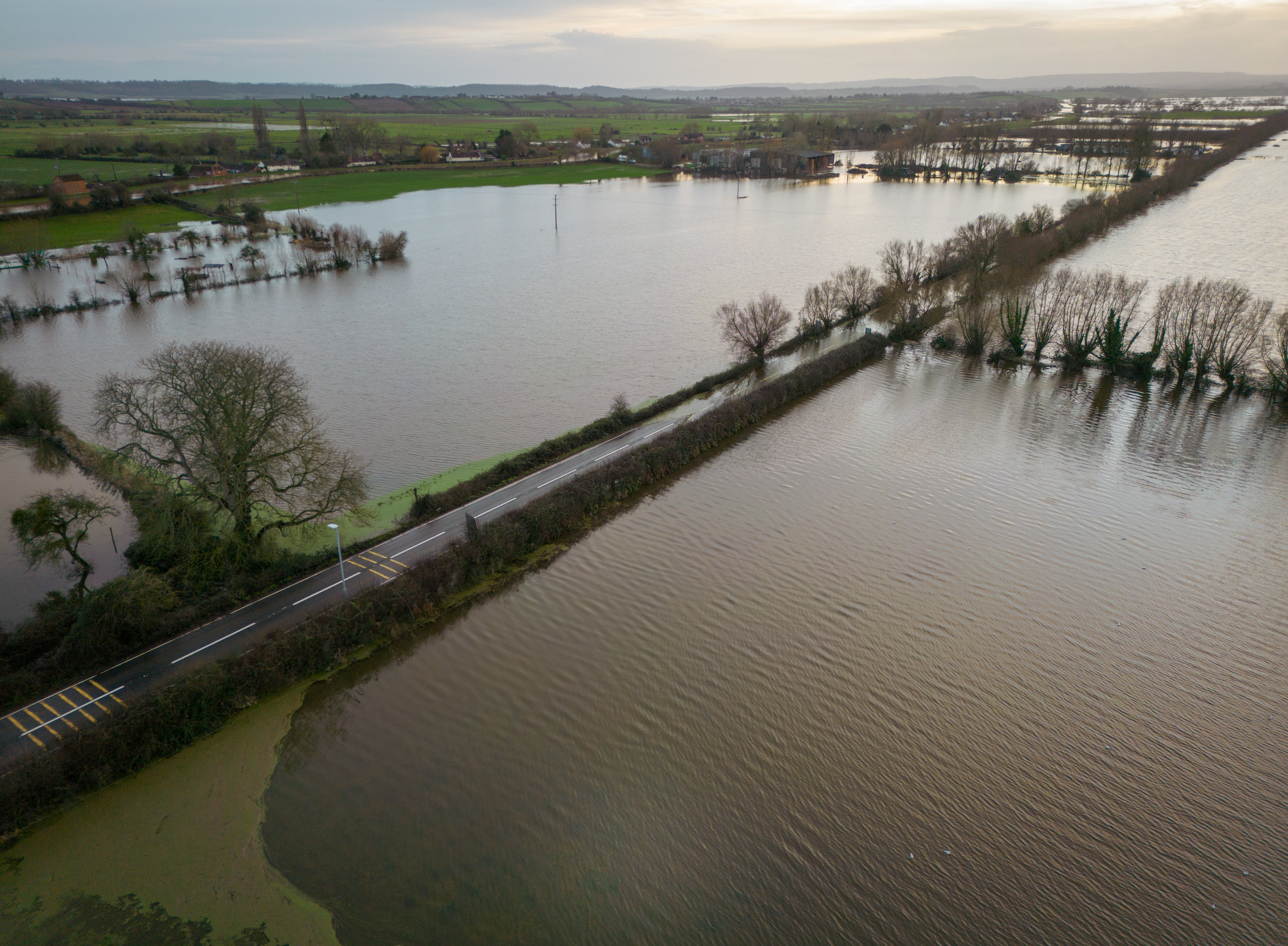 Flood water surrounds the A361 road n Burrowbridge which has been closed to vehicles