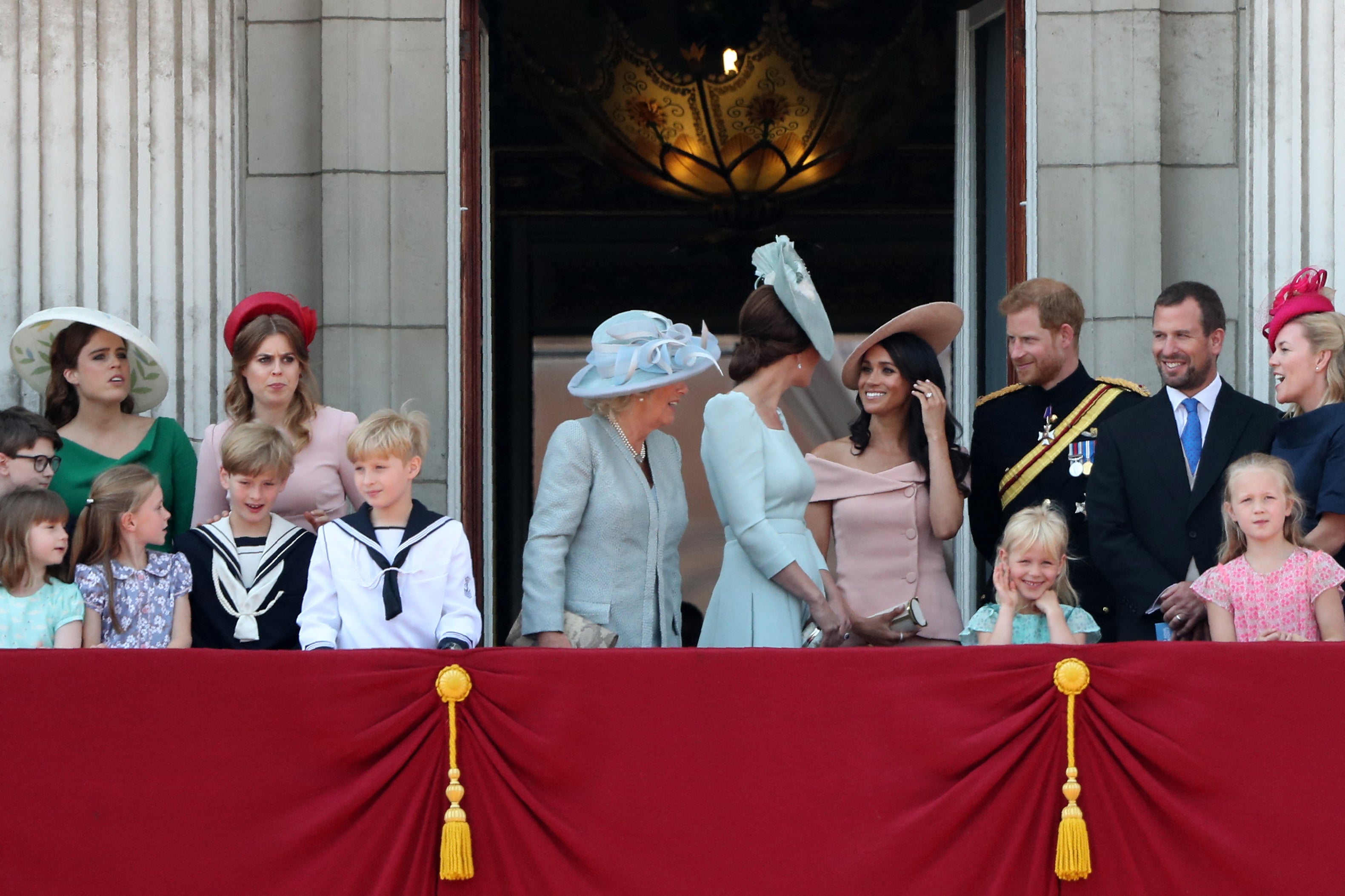 Meghan Markle is seen talking to the Princess of Wales during balcony appearance