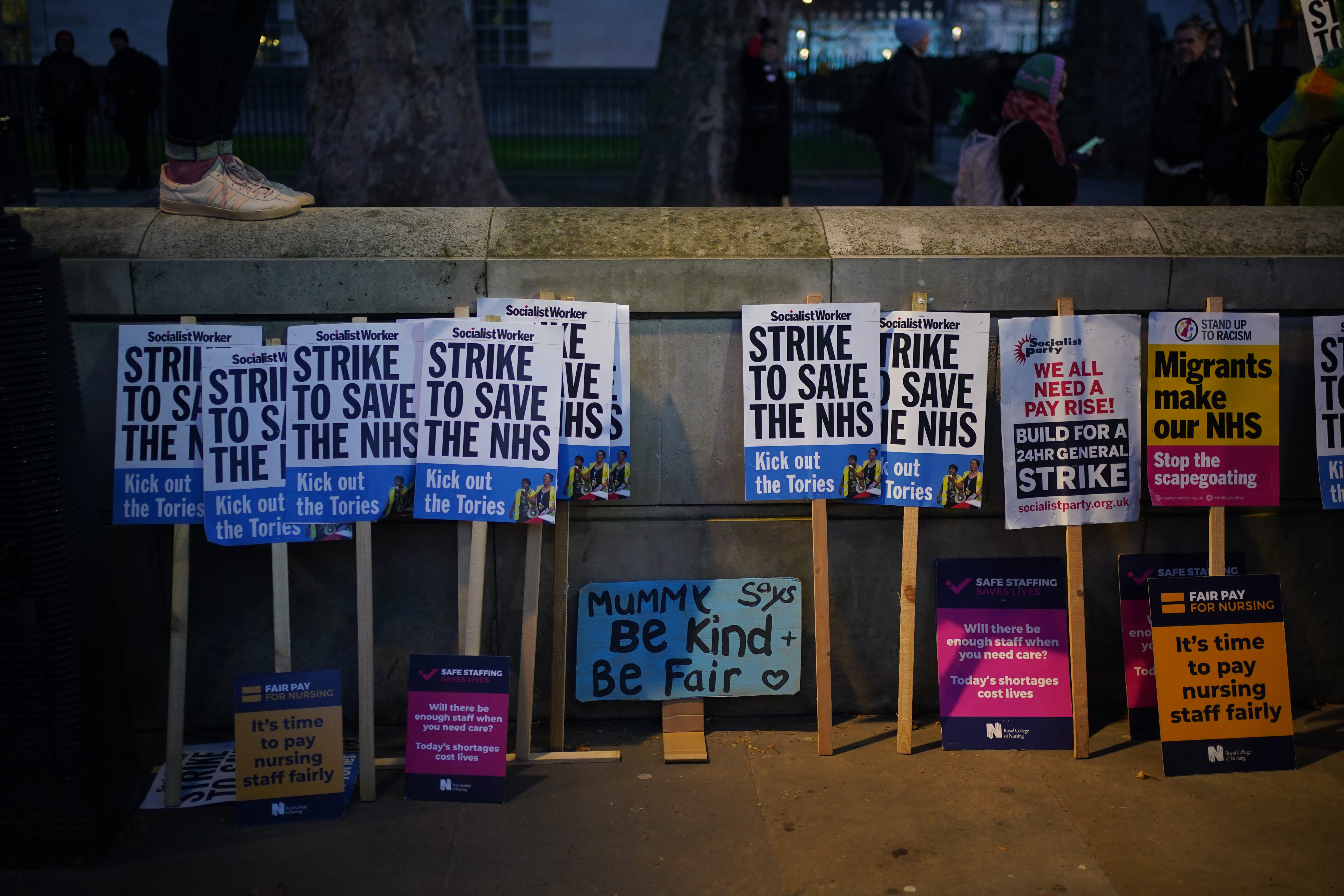 Placards placed against a wall in Whitehall, London, during the nurses strike, against the Bill on minimum service levels during strikes. Picture date: Wednesday January 18, 2023 (Yui Mok/PA)