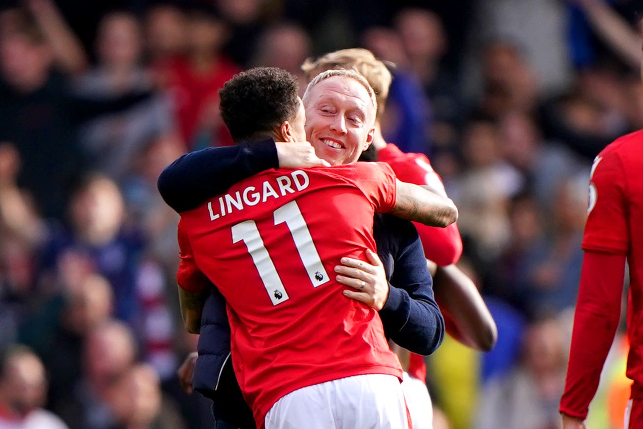 Nottingham Forest manager Steve Cooper celebrates with Jesse Lingard (Joe Giddens/PA)