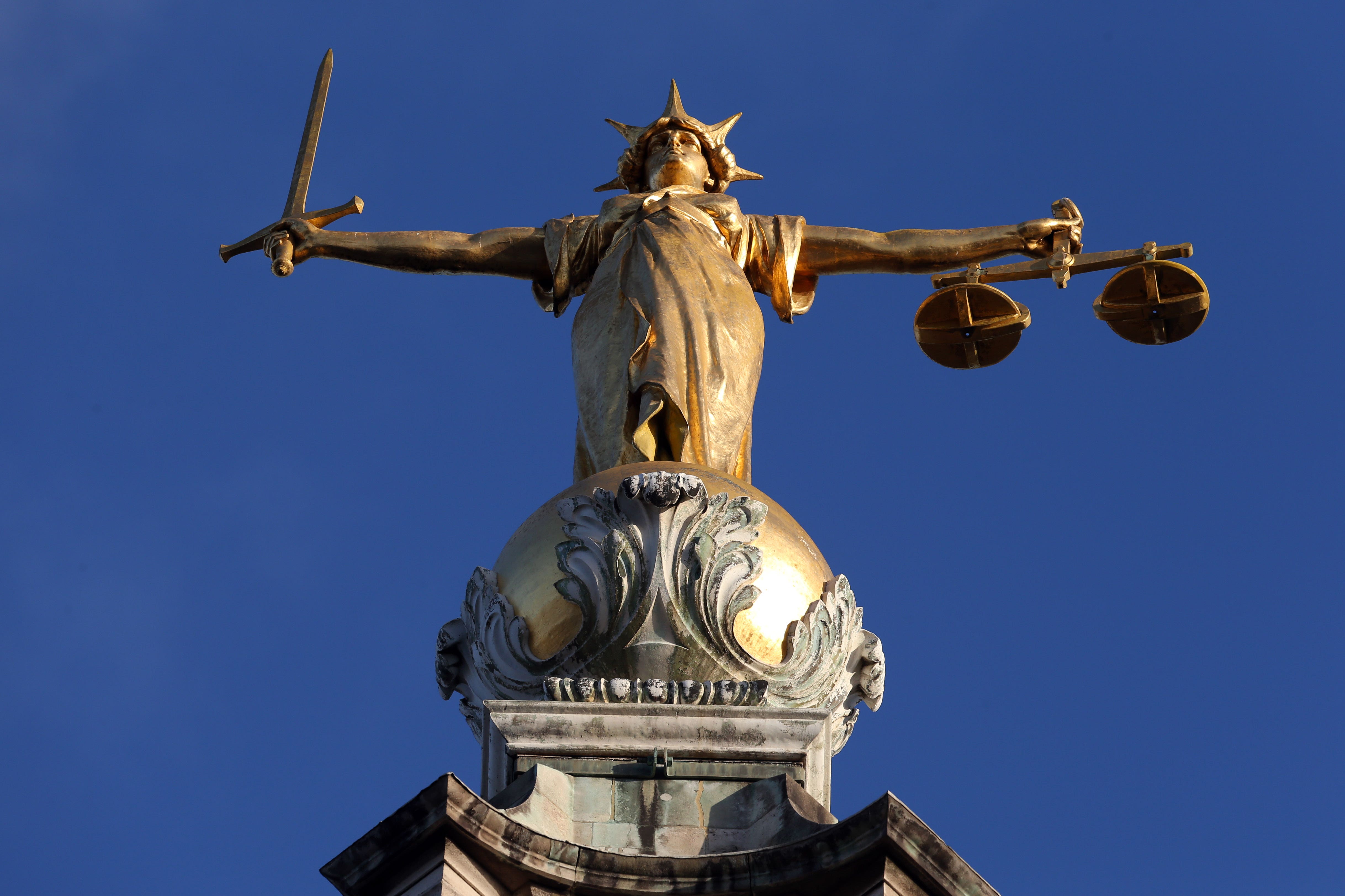 FW Pomeroy’s Statue of Justice stands atop the Central Criminal Court building, Old Bailey, London.