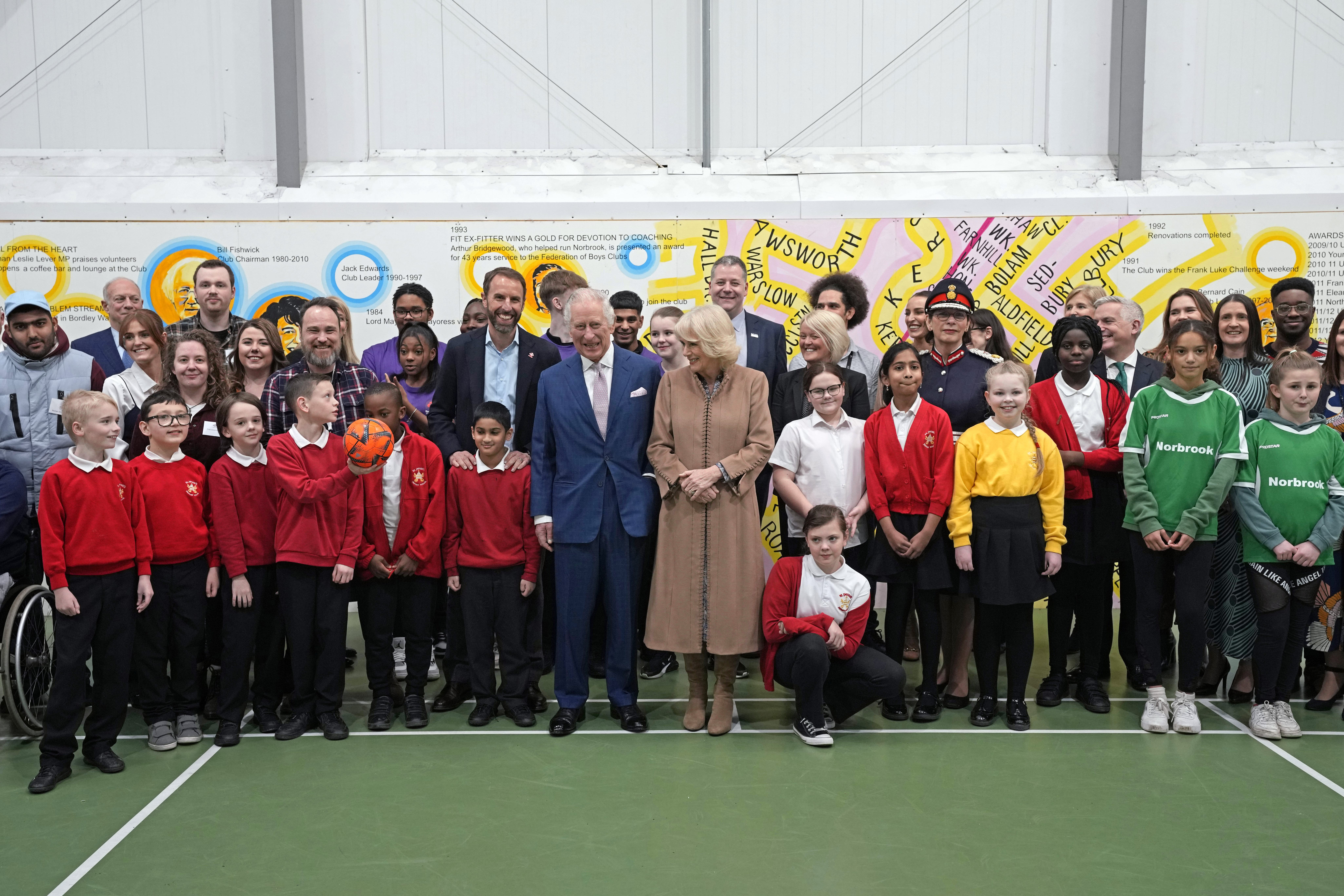 The King and Queen Consort have their photo taken with Gareth Southgate, England football manager and Prince’s Trust ambassador (Frank Augustein/PA)