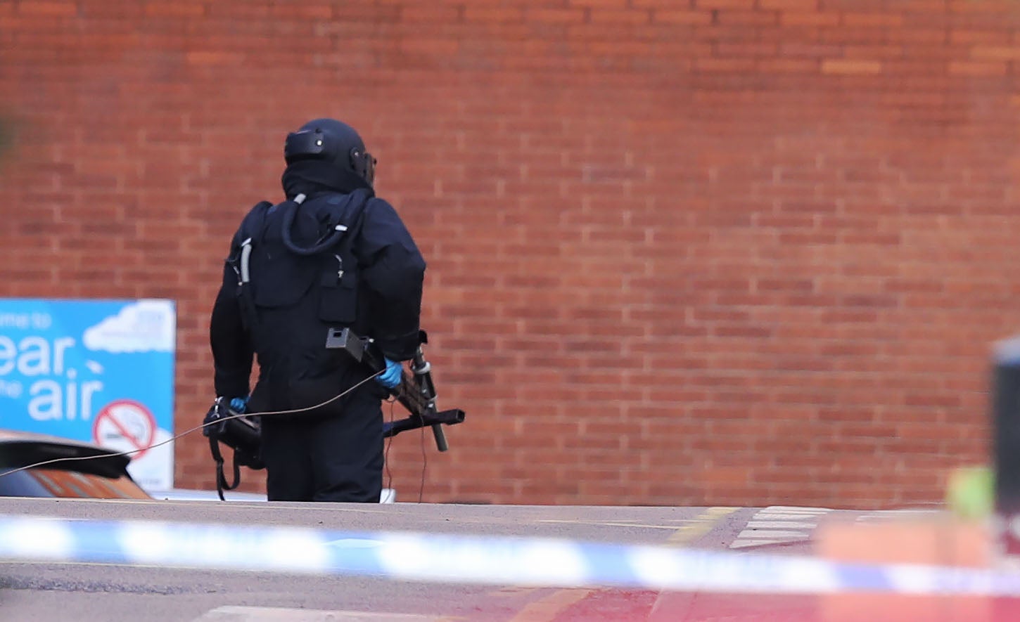 A member of the bomb disposal unit wearing protective equipment at St James's Hospital, Leeds