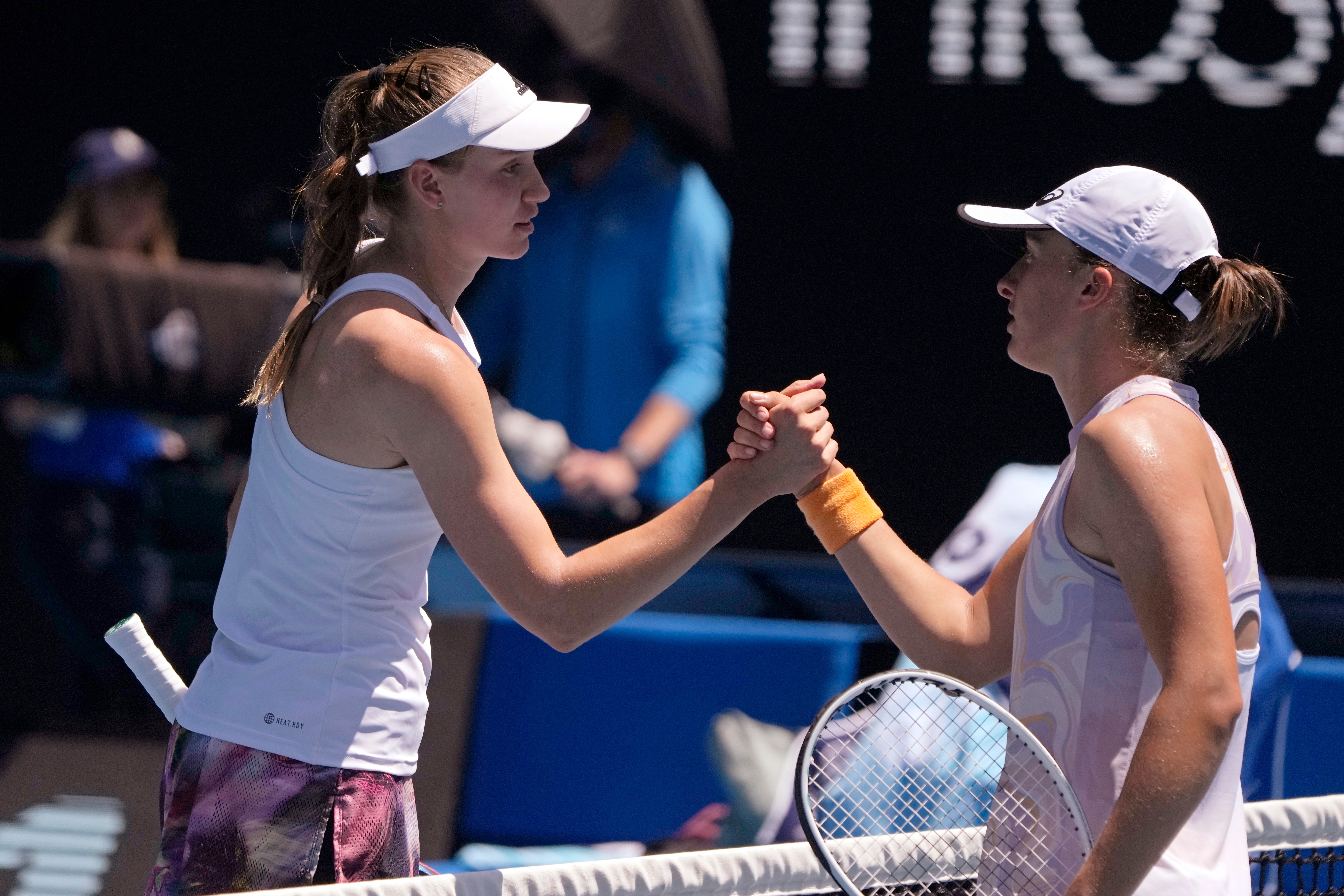 Elena Rybakina, left, stunned Iga Swiatek