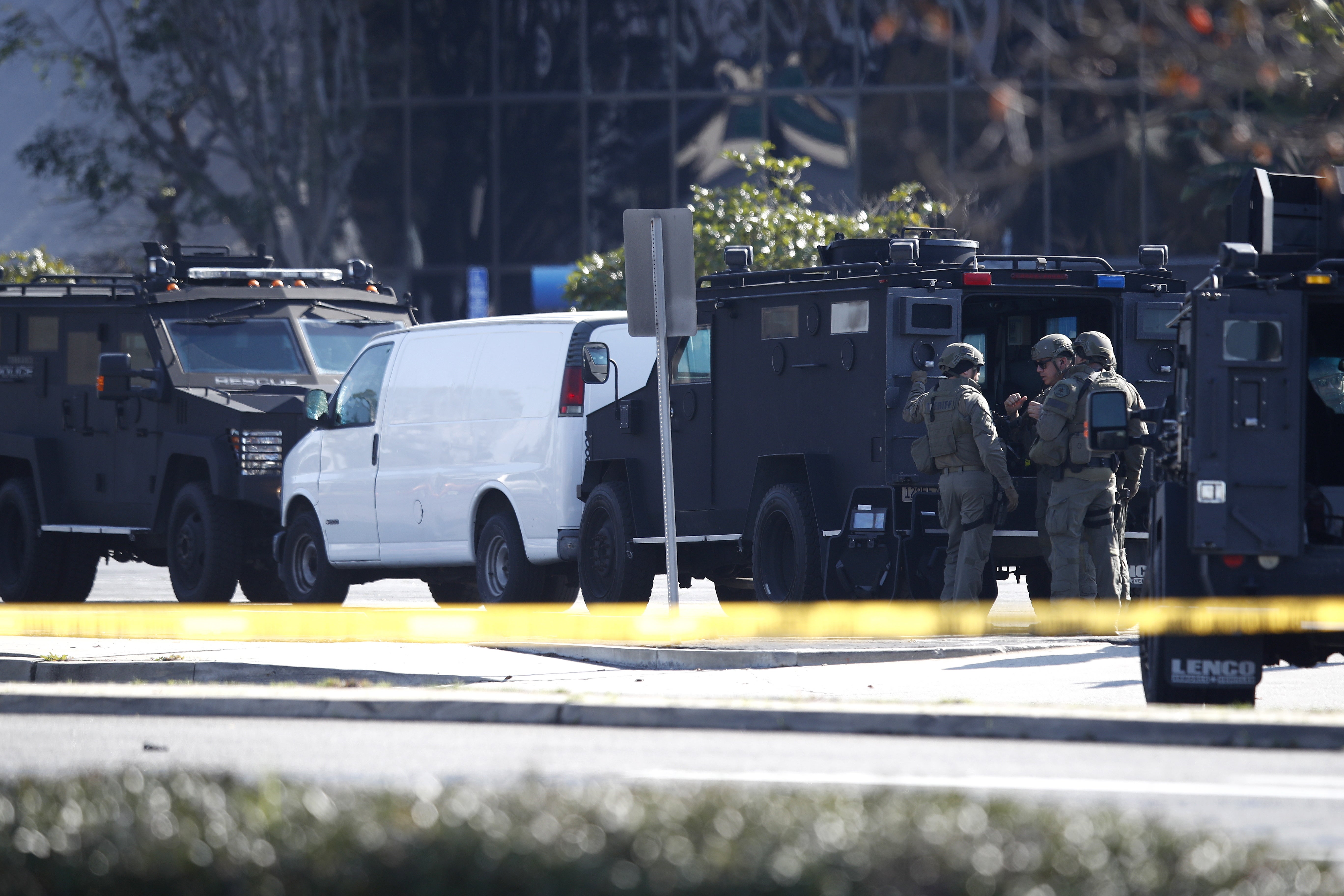 Police surround the white van in Torrance