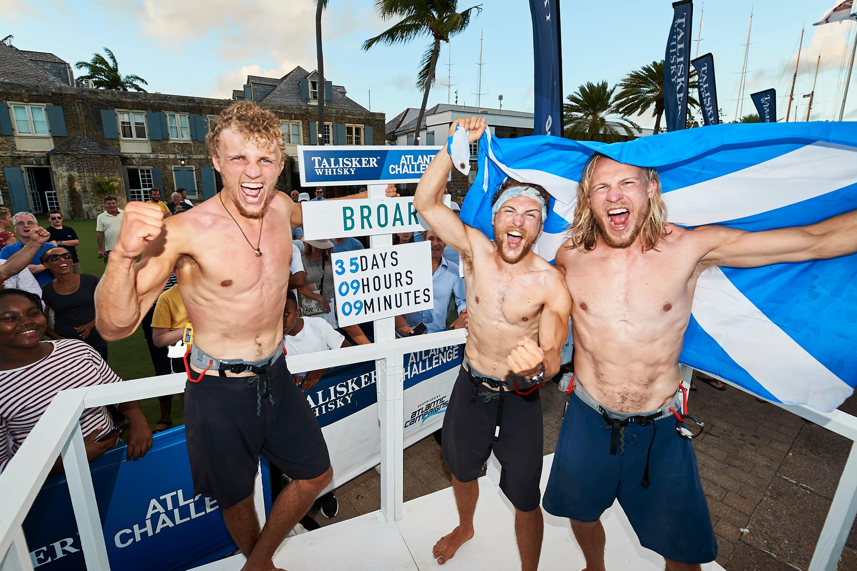 Lachlan, Ewan and Jamie MacLean after sailing across the ocean (Elaine Livingstone/PA)