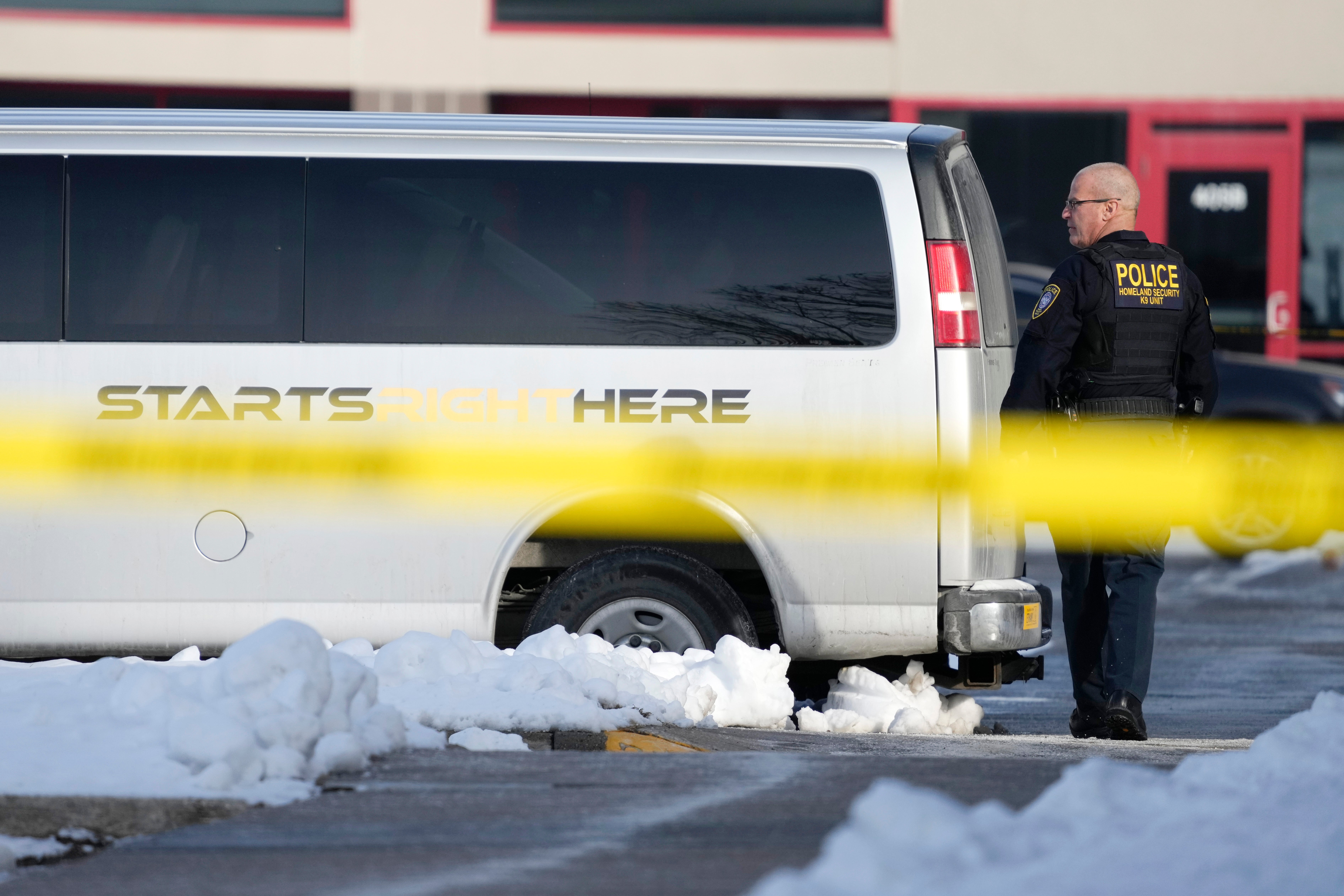 A law enforcement officer walks outside the Starts Right Here building, Monday, Jan. 23, 2023, in Des Moines, Iowa.