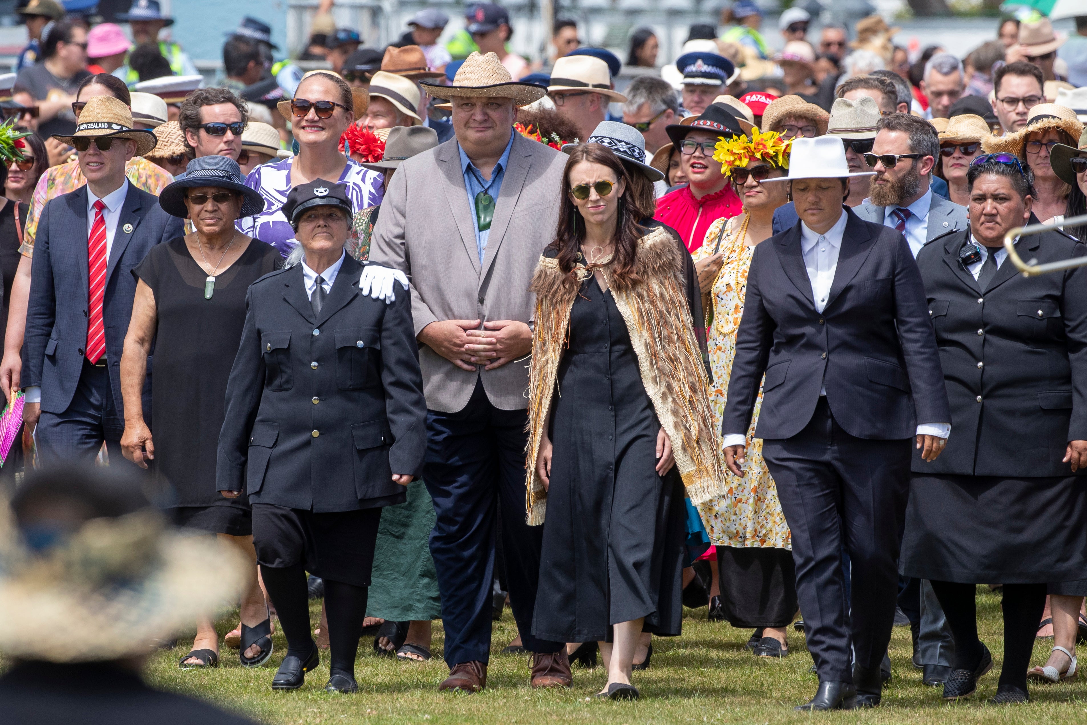 New Zealand Prime Minister Jacinda Ardern, center, and her caucus arrive at Ratana, New Zealand