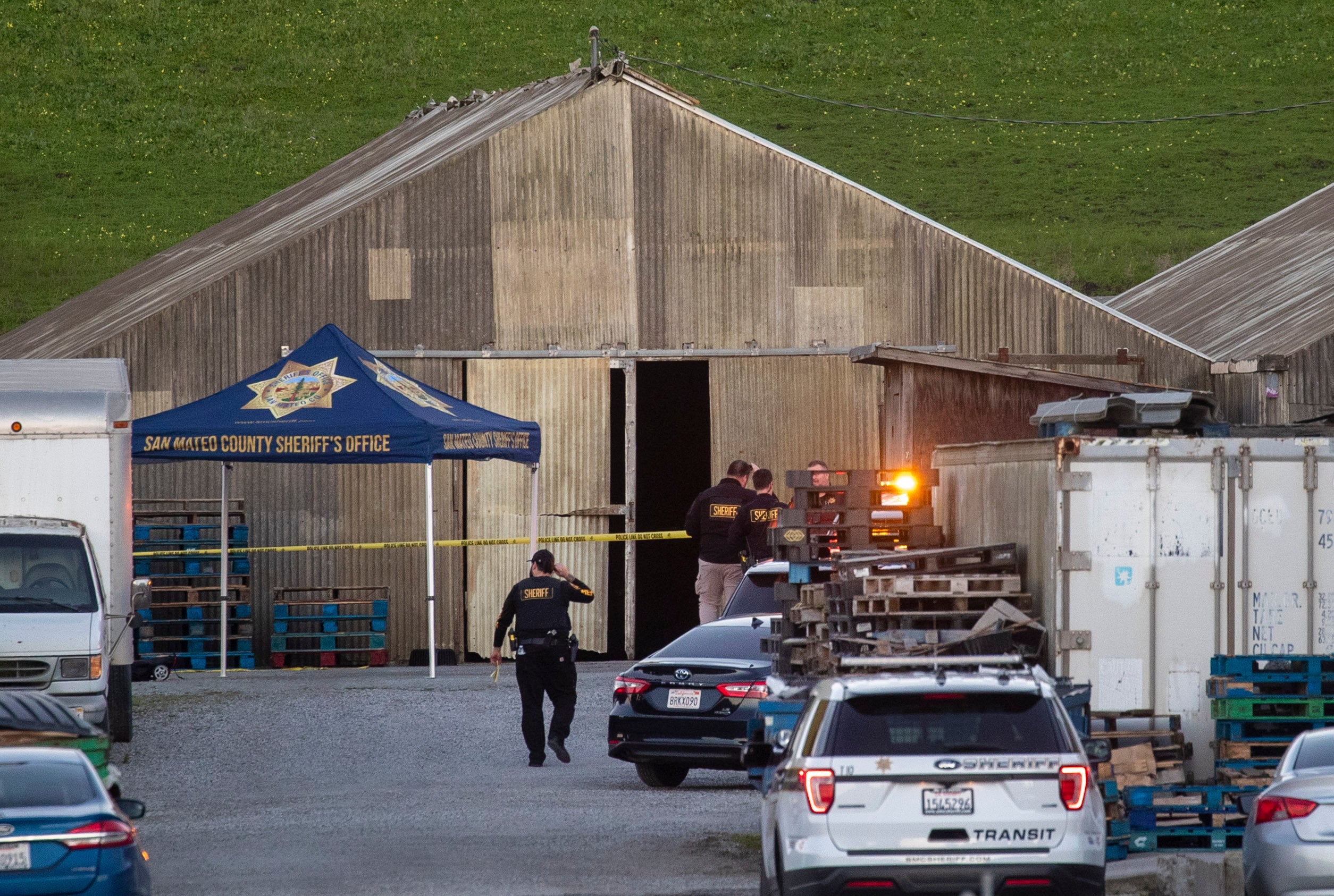 Police investigate the scene of a mass shooting off Cabrillo Highway in Half Moon Bay