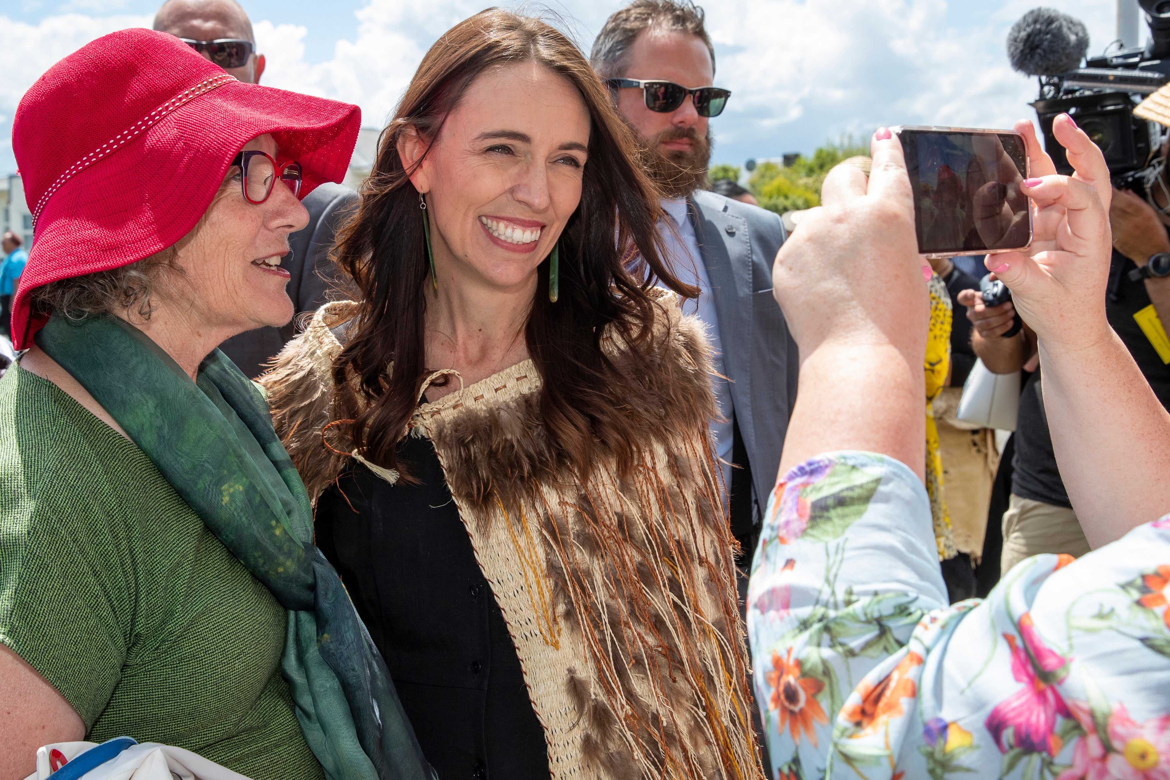 New Zealand Prime Minister Jacinda Ardern, center, has a photo taken as she arrives at Ratana, New Zealand