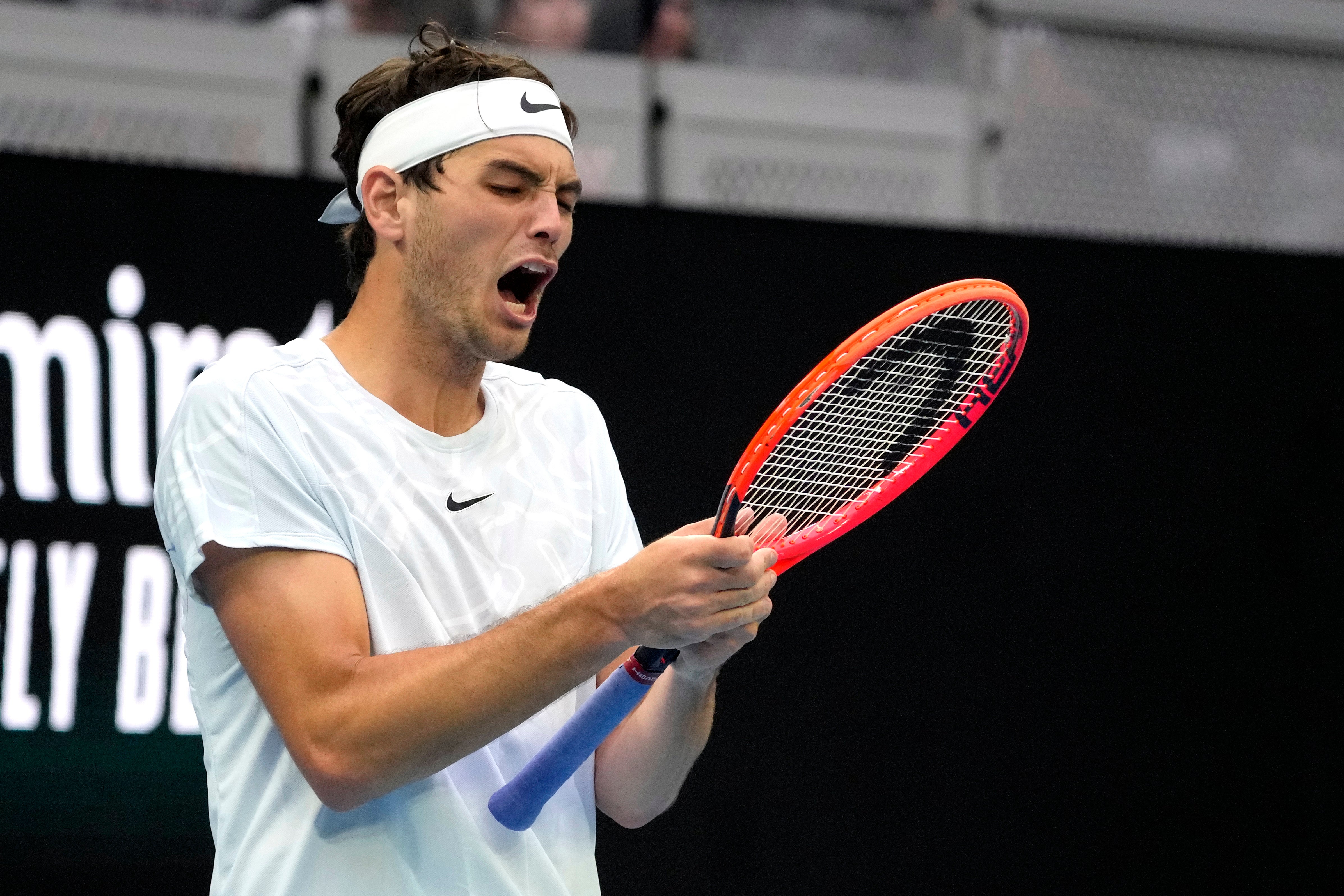 Taylor Fritz reacts during his match against Australia’s Alexei Popyrin