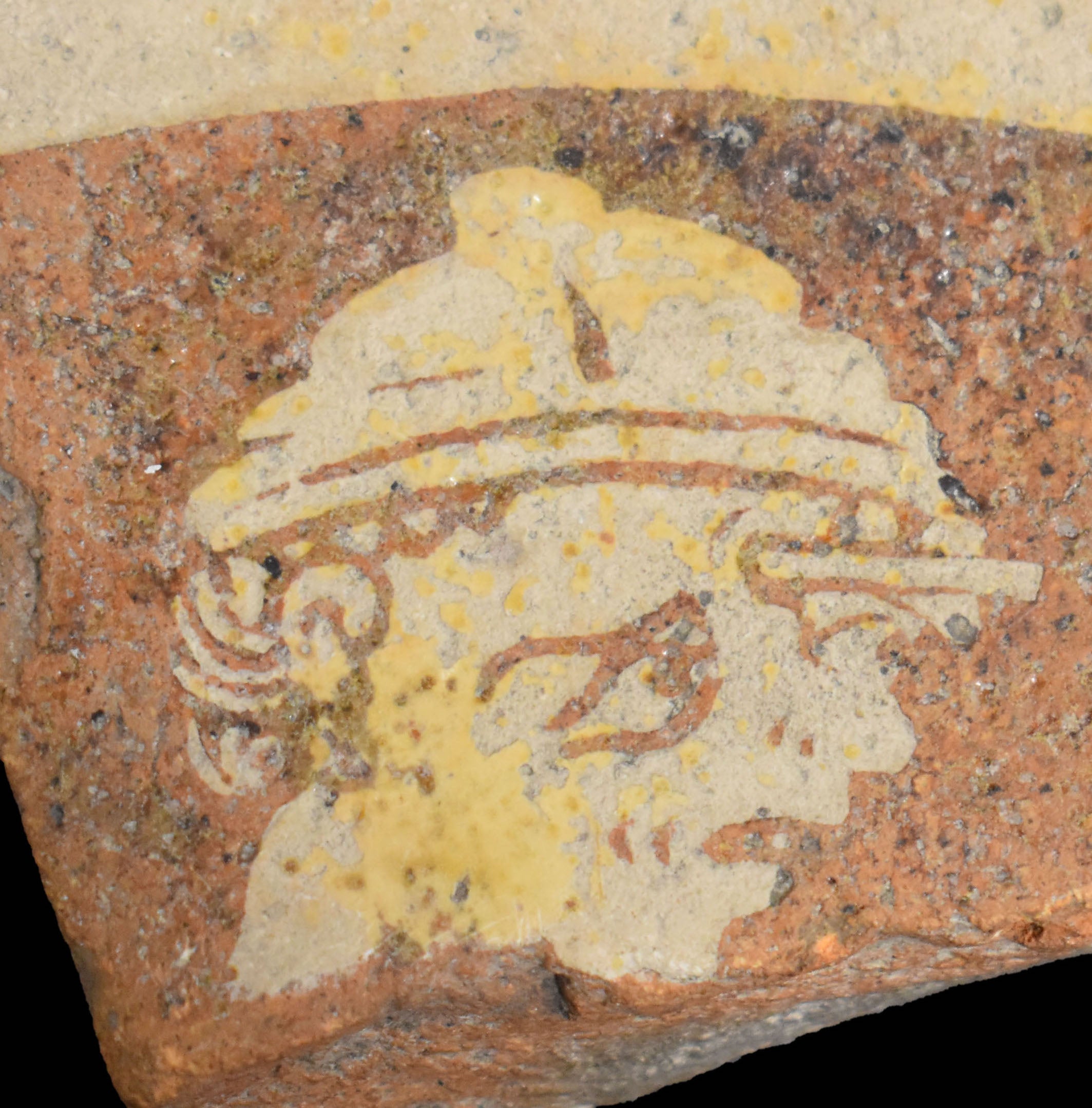 Caption: Violence on the floor. As part of the pro-crusades propaganda royal palace pavement, this saracen soldier is graphicly portrayed with a crusader arrow in his forehead.