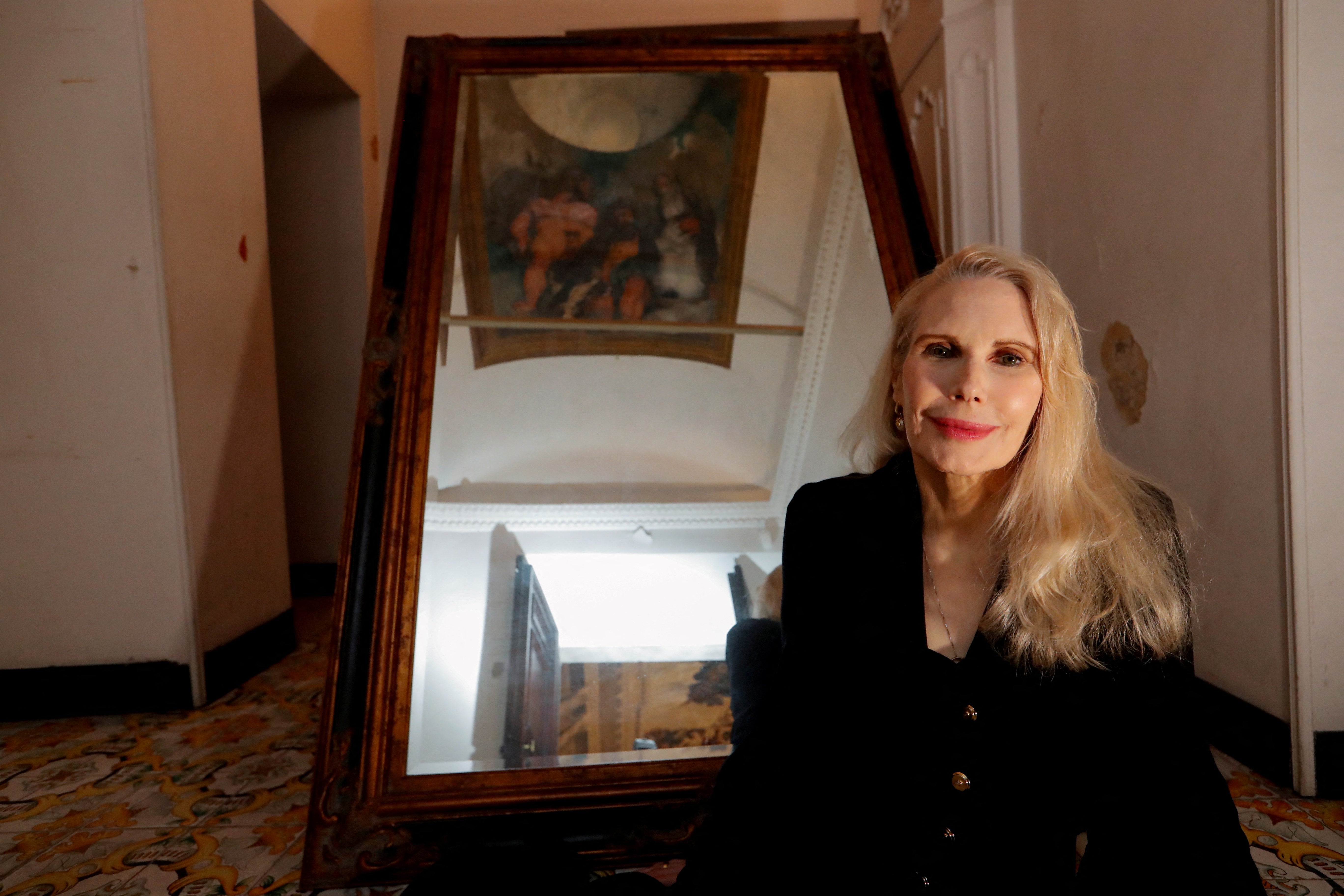 Princess Rita Boncompagni Ludovisi poses for a photograph below Caravaggio's only ceiling mural inside Villa Aurora, in Rome, Italy, November 16, 2021.