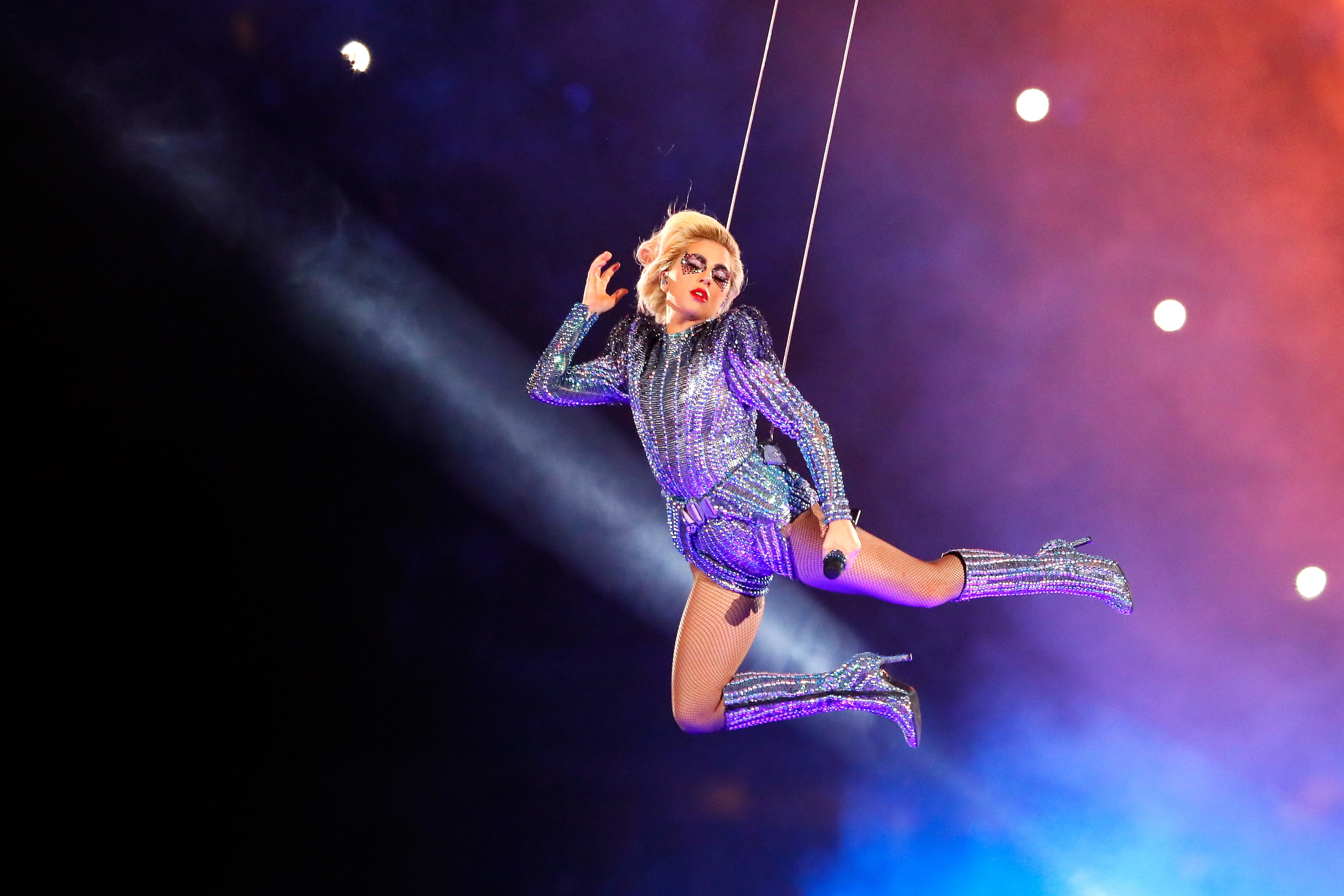 Lady Gaga began her 2017 halftime show on the roof of the NRG Stadium in a Versace bodysuit