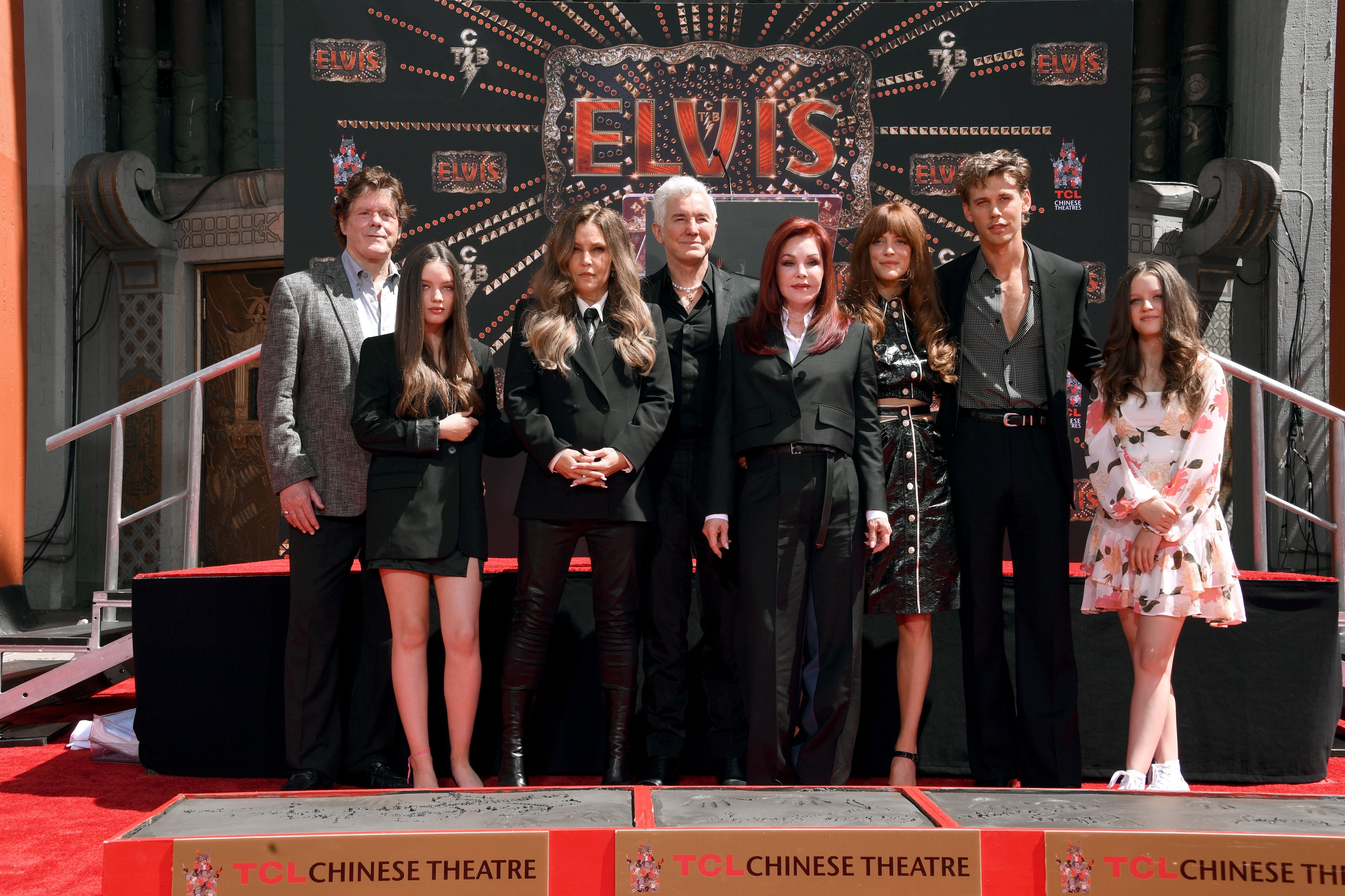 Butler alongside Baz Luhrmann and members of the Presley family