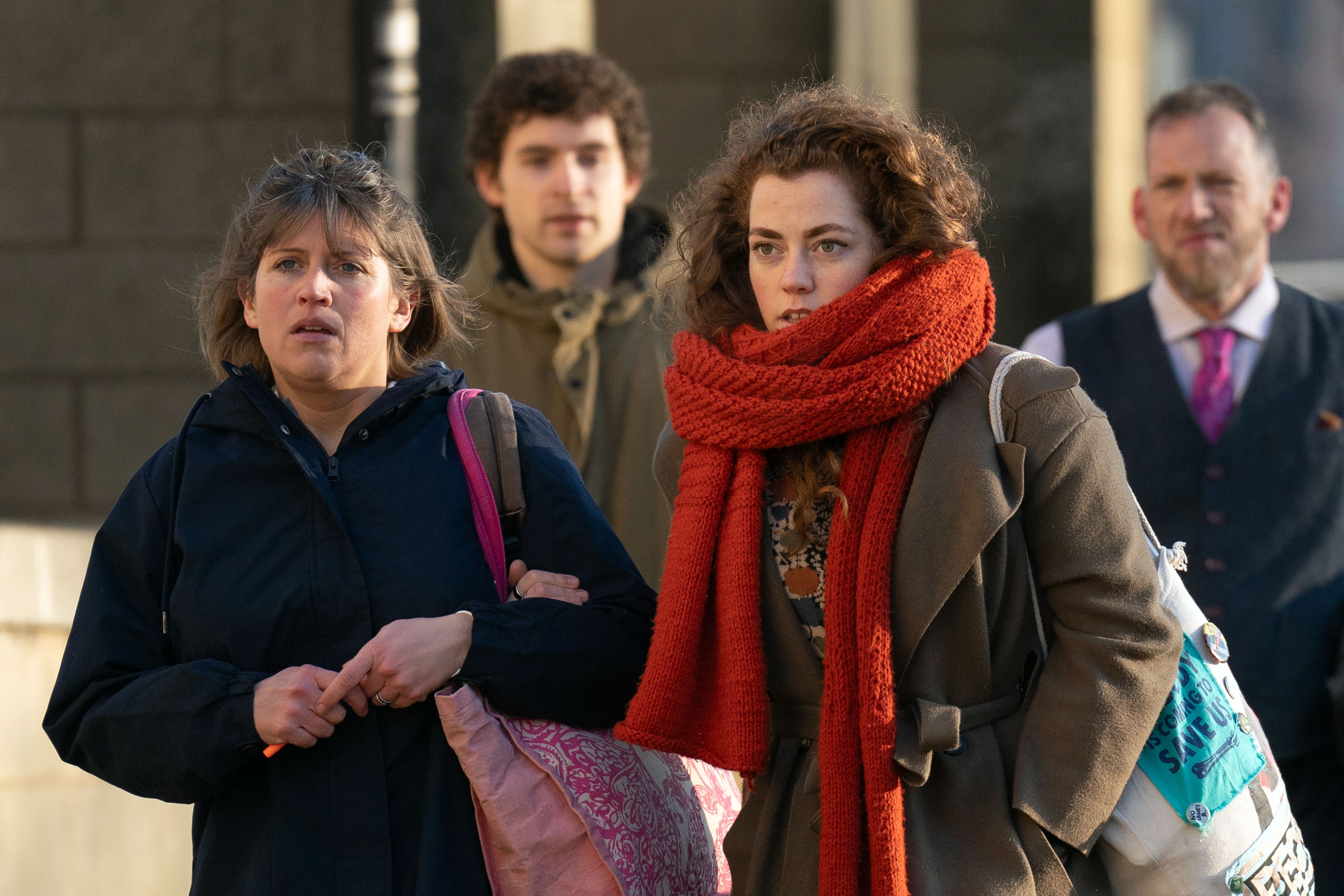 Just Stop Oil protesters arriving at Northampton Crown Court charged with conspiracy to cause public nuisance over a track protest during the Formula One British Grand Prix at Silverstone in July 2022 (Joe Giddens/PA)