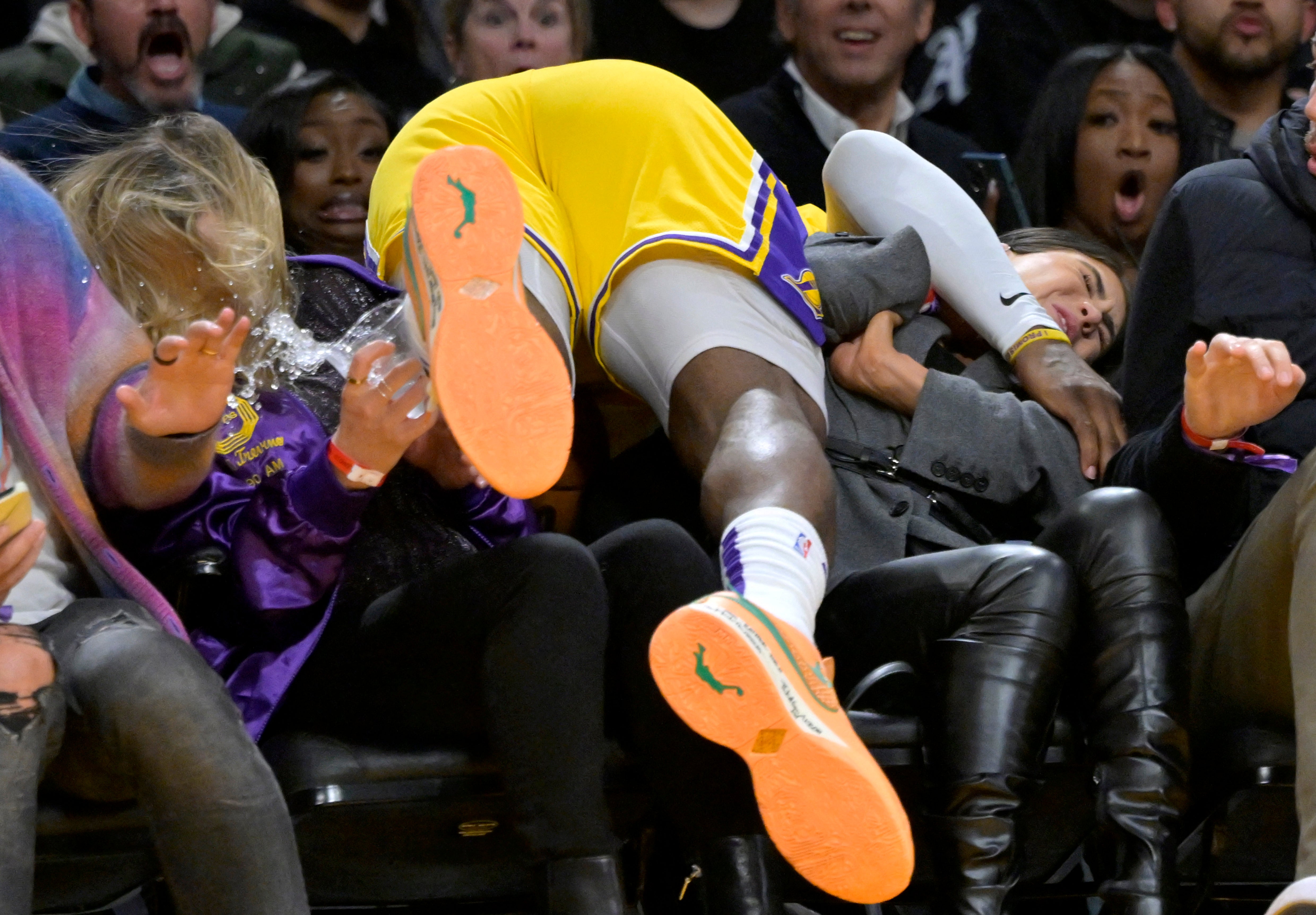 LeBron James crashes through the front row of spectactors