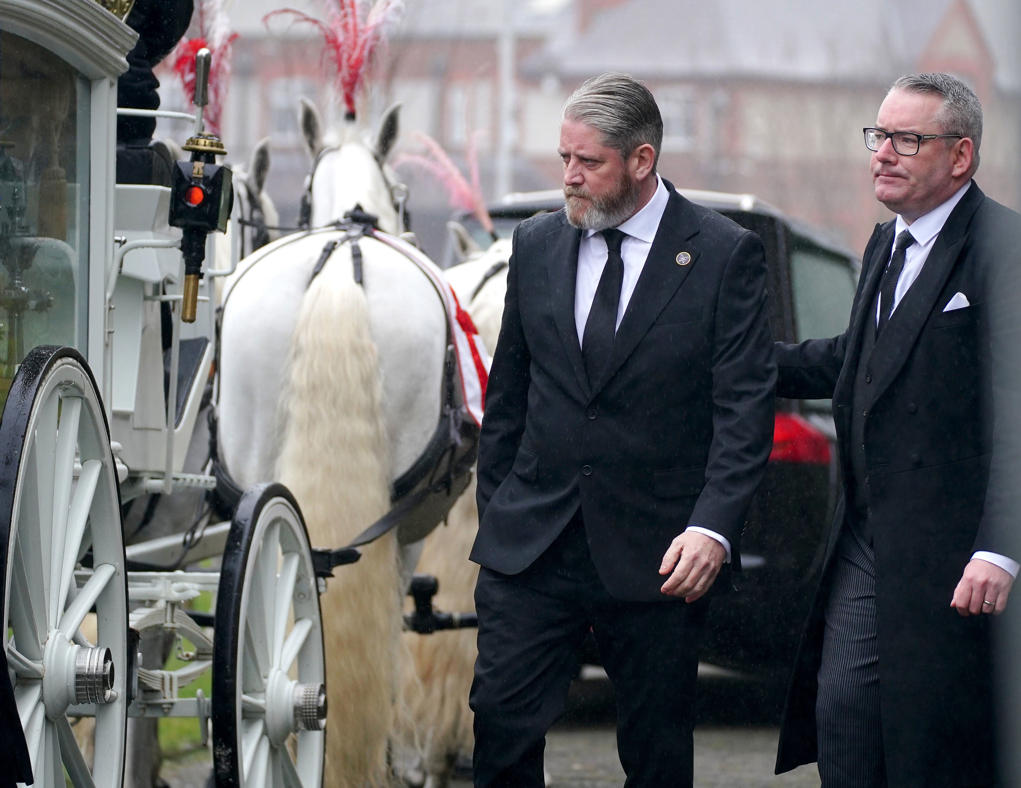 Elle Edwards' father, Tim Edwards, walks to join the bearer party to carry her coffin at her funeral in St Nicholas's Church, Wallasey