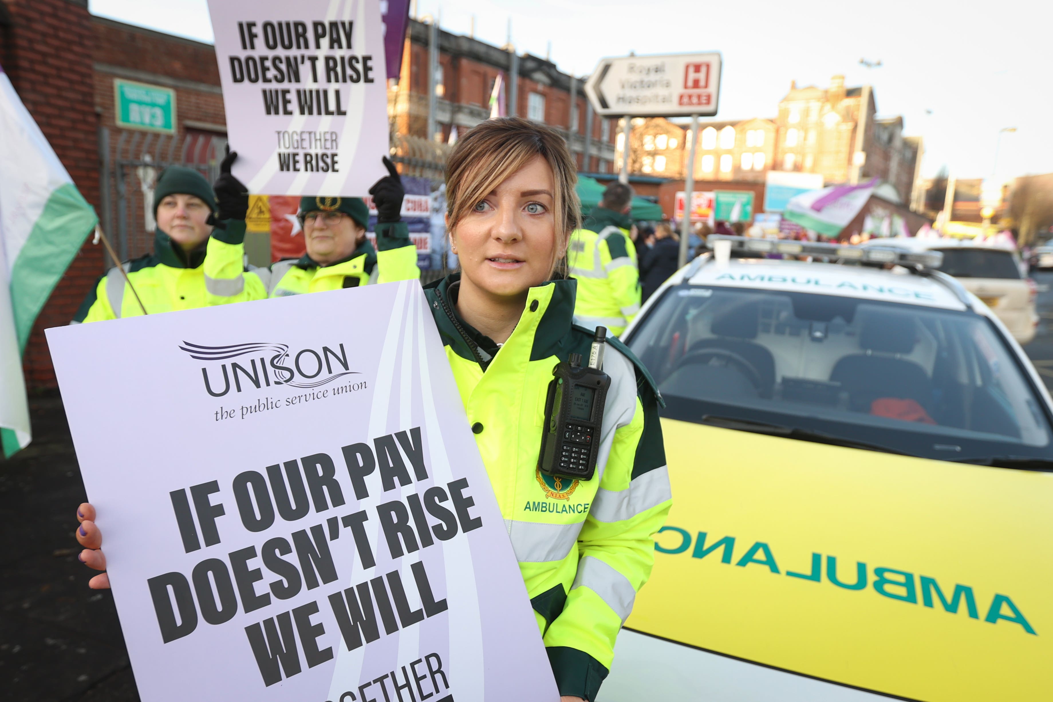 Kate McKeague, an ambulance care assistant, joins her colleagues on the picket line outside the Royal Victoria Hospital in Belfast (Liam McBurney/PA)