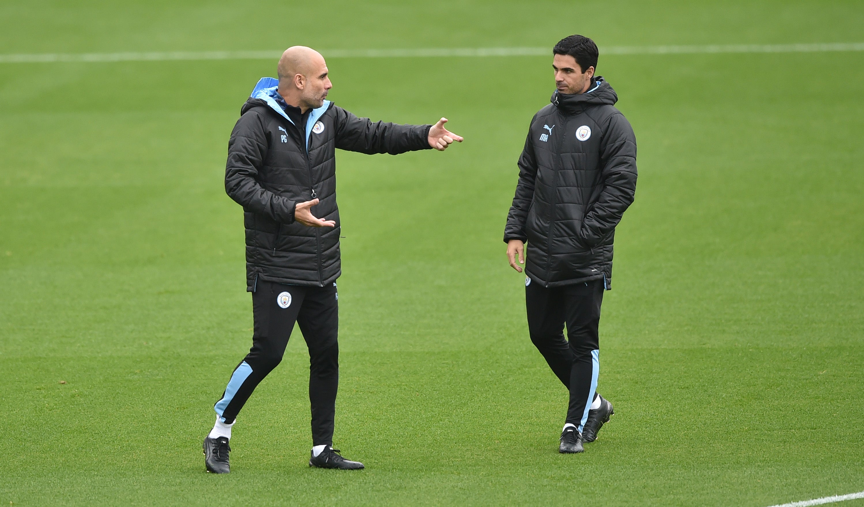 Pep Guardiola and Mikel Arteta during their time together at Manchester City