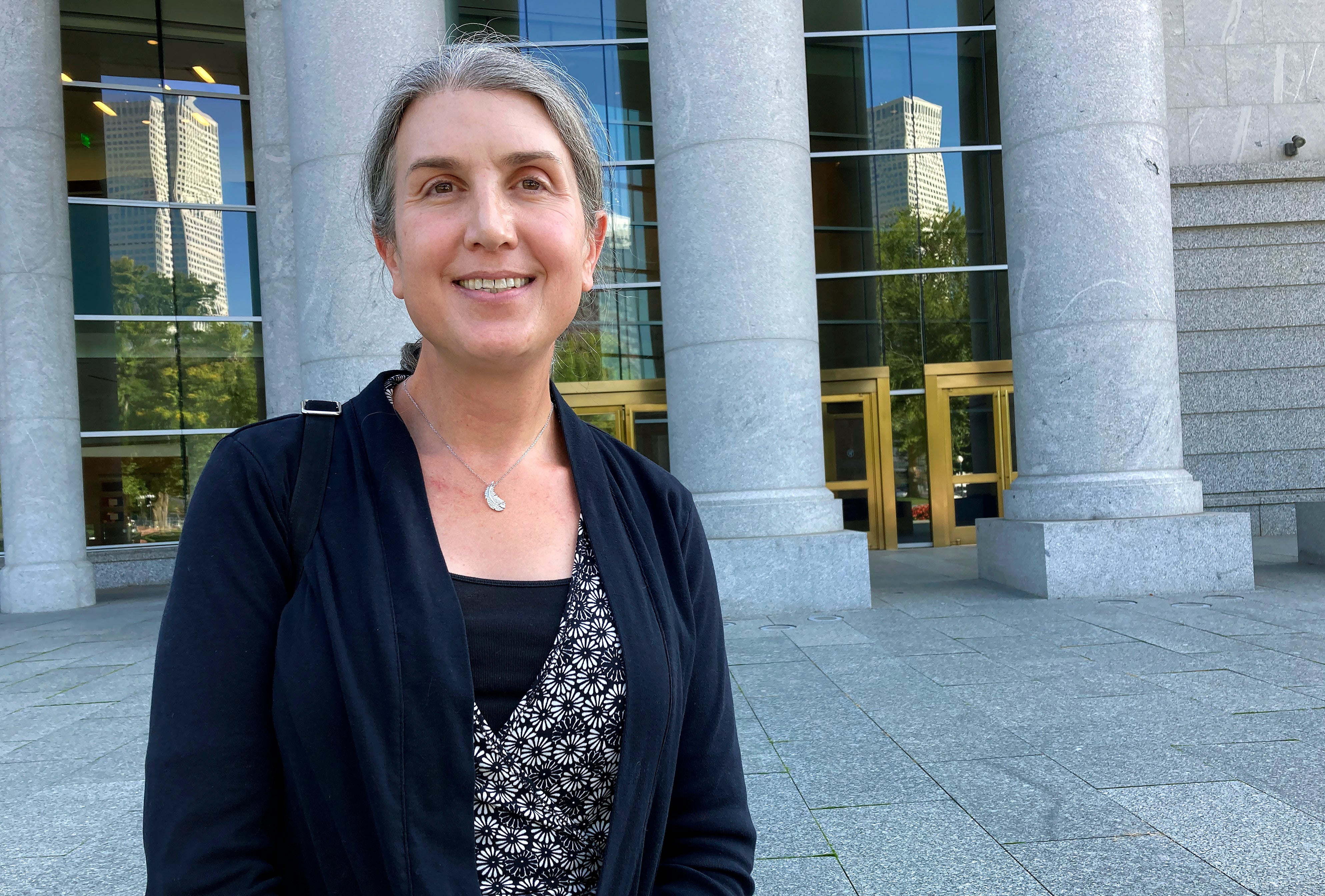 Colorado lawyer Autumn Scardina poses for a photo outside the Ralph Carr Colorado Judicial Center