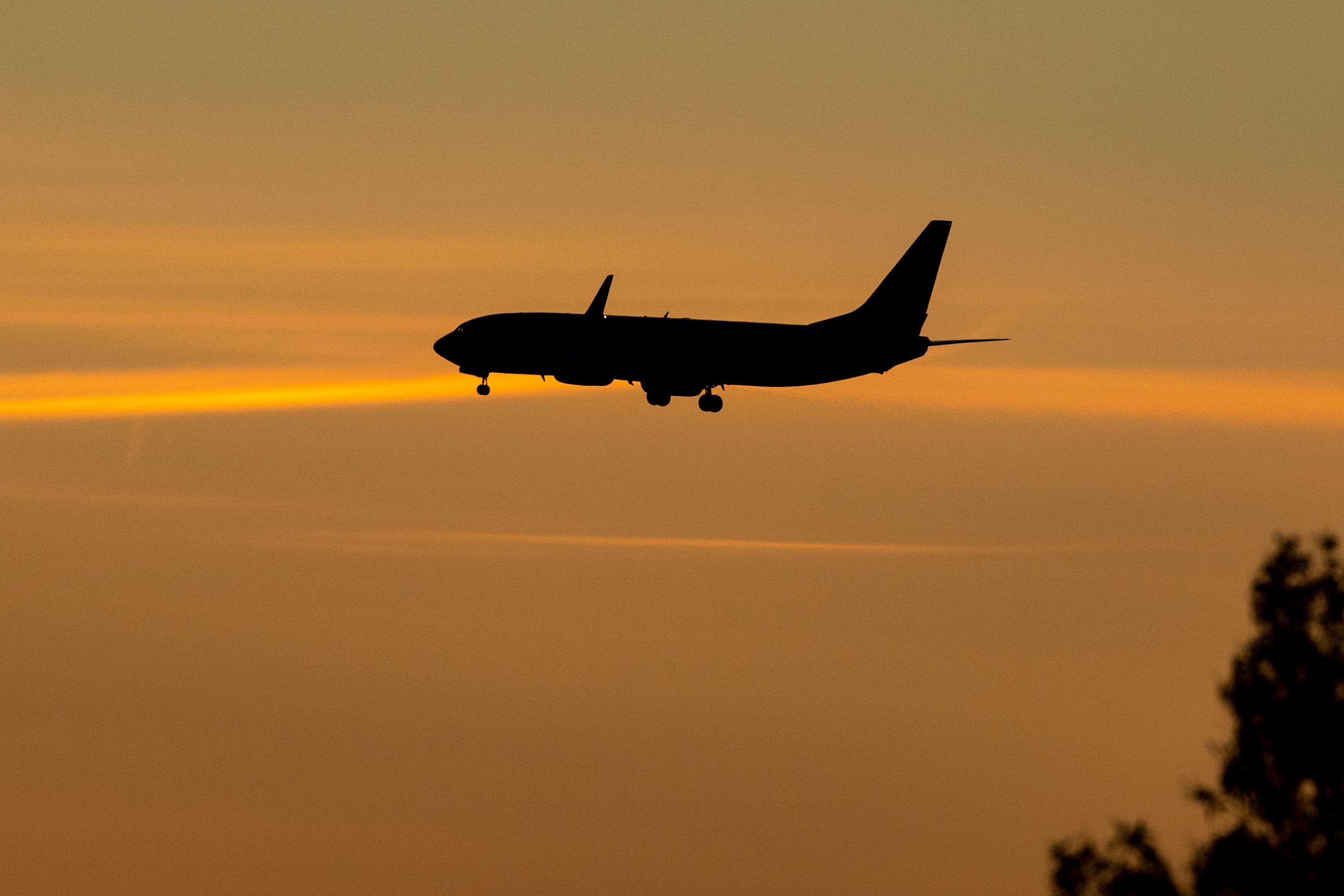 Half of people are planning to cut the cost of their holidays or do without trips altogether this year, according to Aviva (Peter Byrne/PA)