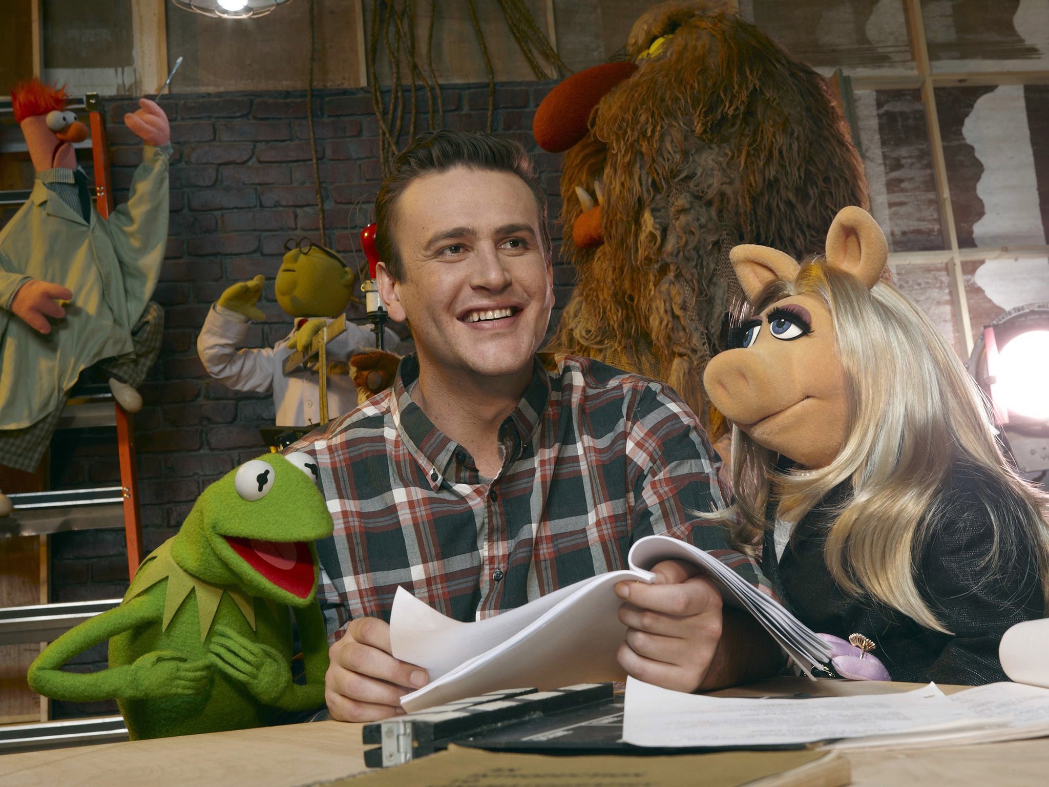 A man and his muppets: Jason Segel in 2011, with Kermit and Miss Piggy