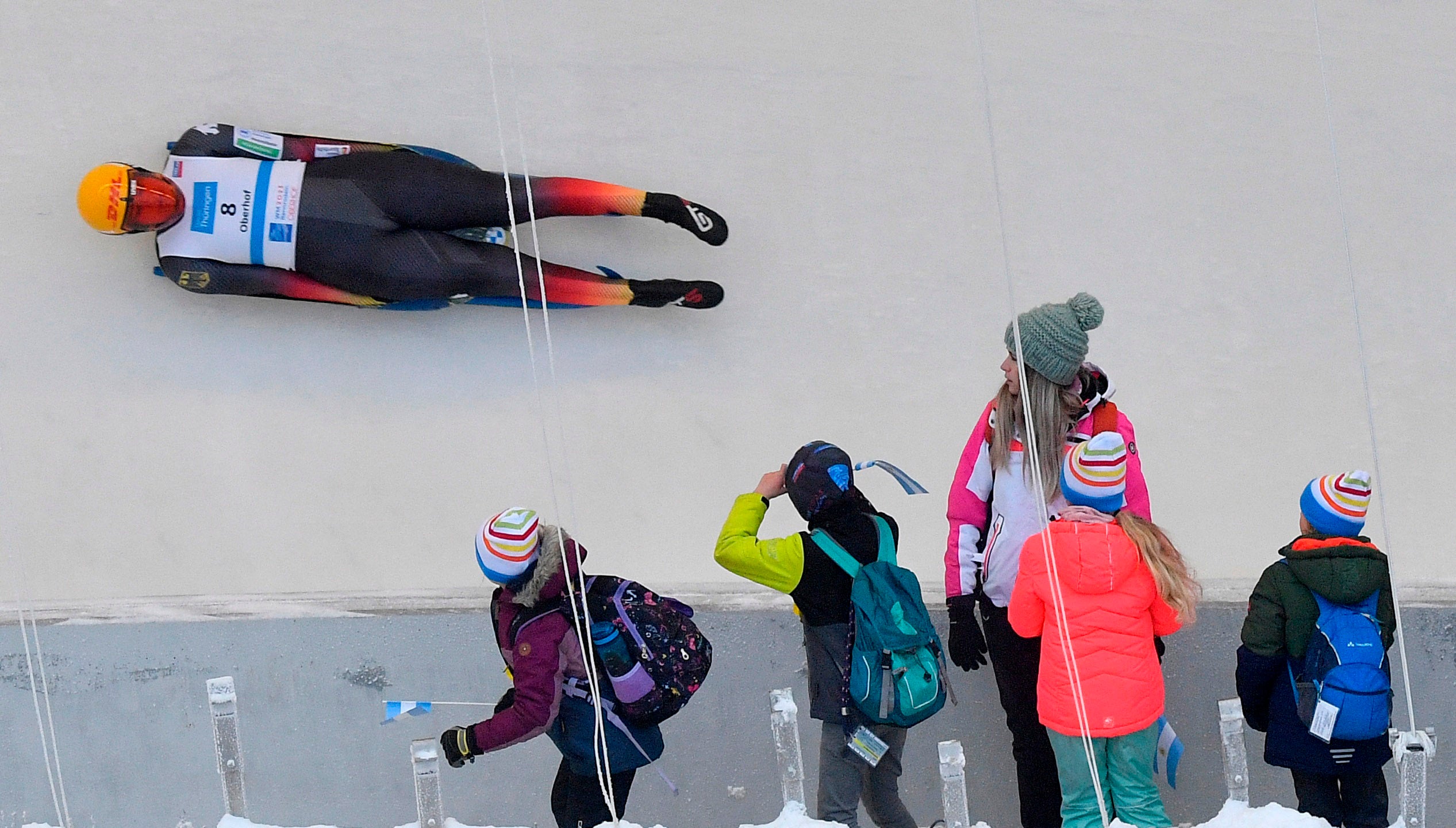 People watch Merle Fraebel during the sprint women’s qualification of the luge at the FIL World Championships in Oberhof, Germany