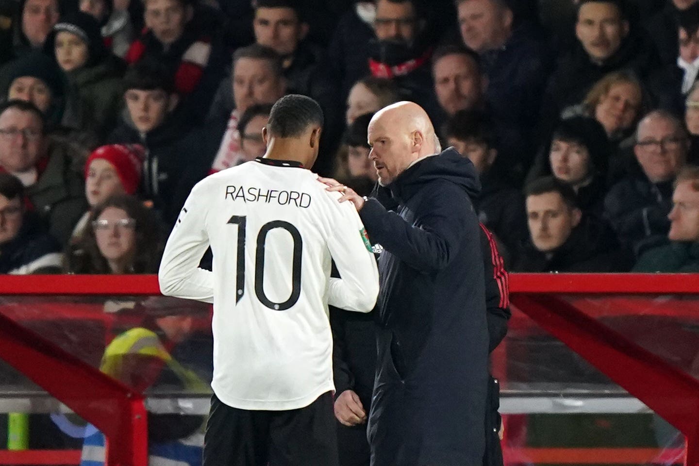 Manchester United manager Erik ten Hag embraces Marcus Rashford, left (Tim Goode/PA)