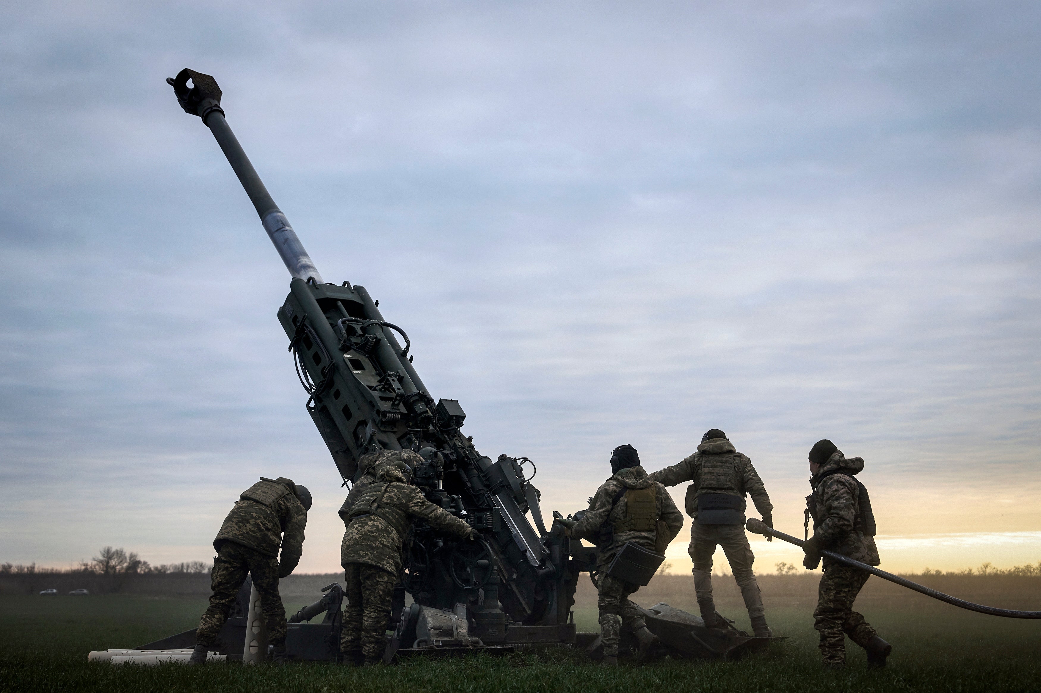 Ukrainian soldiers prepare a U.S.-supplied M777 howitzer to fire at Russian positions in Kherson region, Ukraine