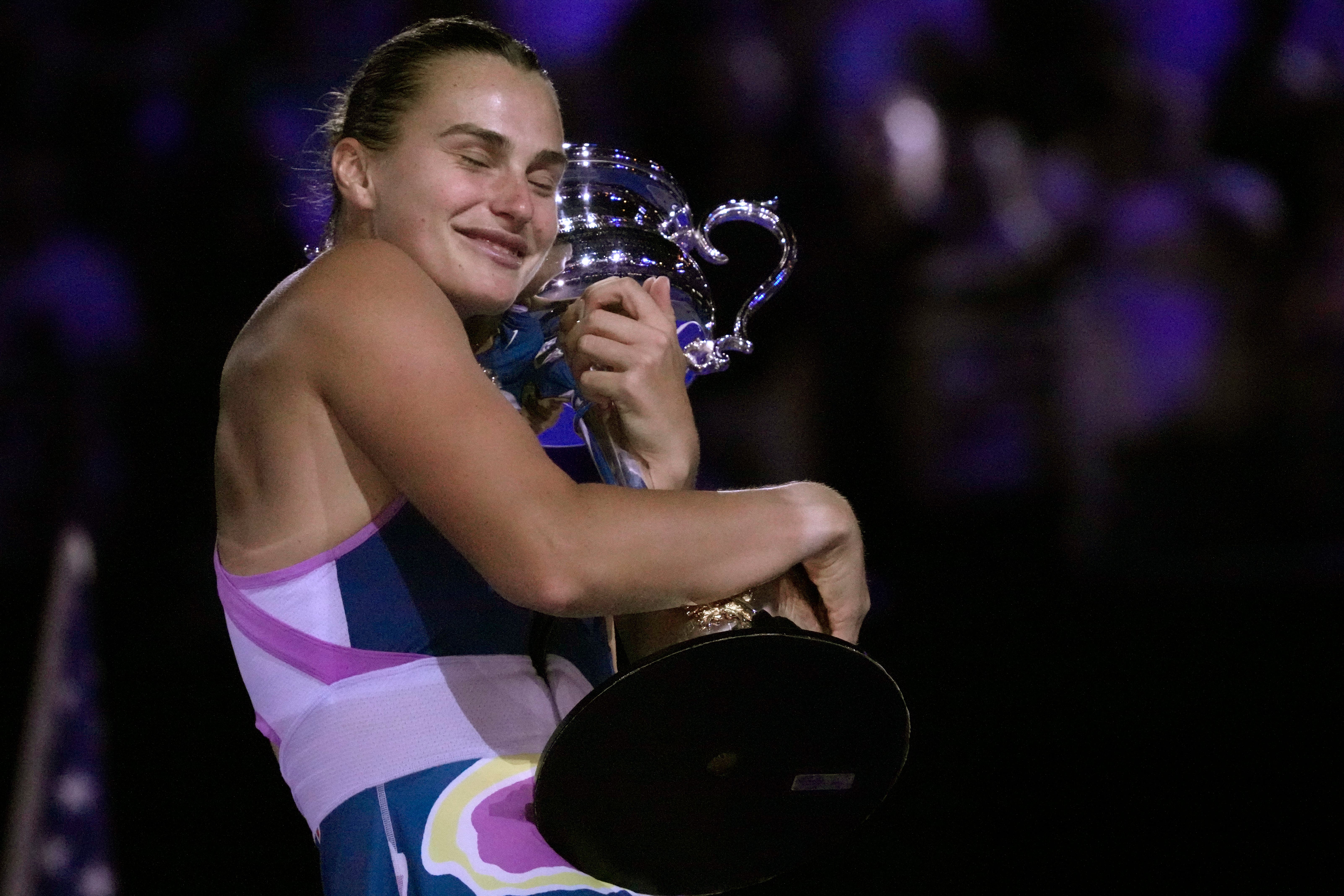 Aryna Sabalenka hugs the Daphne Akhurst Memorial Cup (Dita Alangkara/AP)