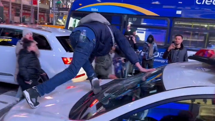 Moment Tyre Nichols protestor smashes NYPD car windshield in Times Square