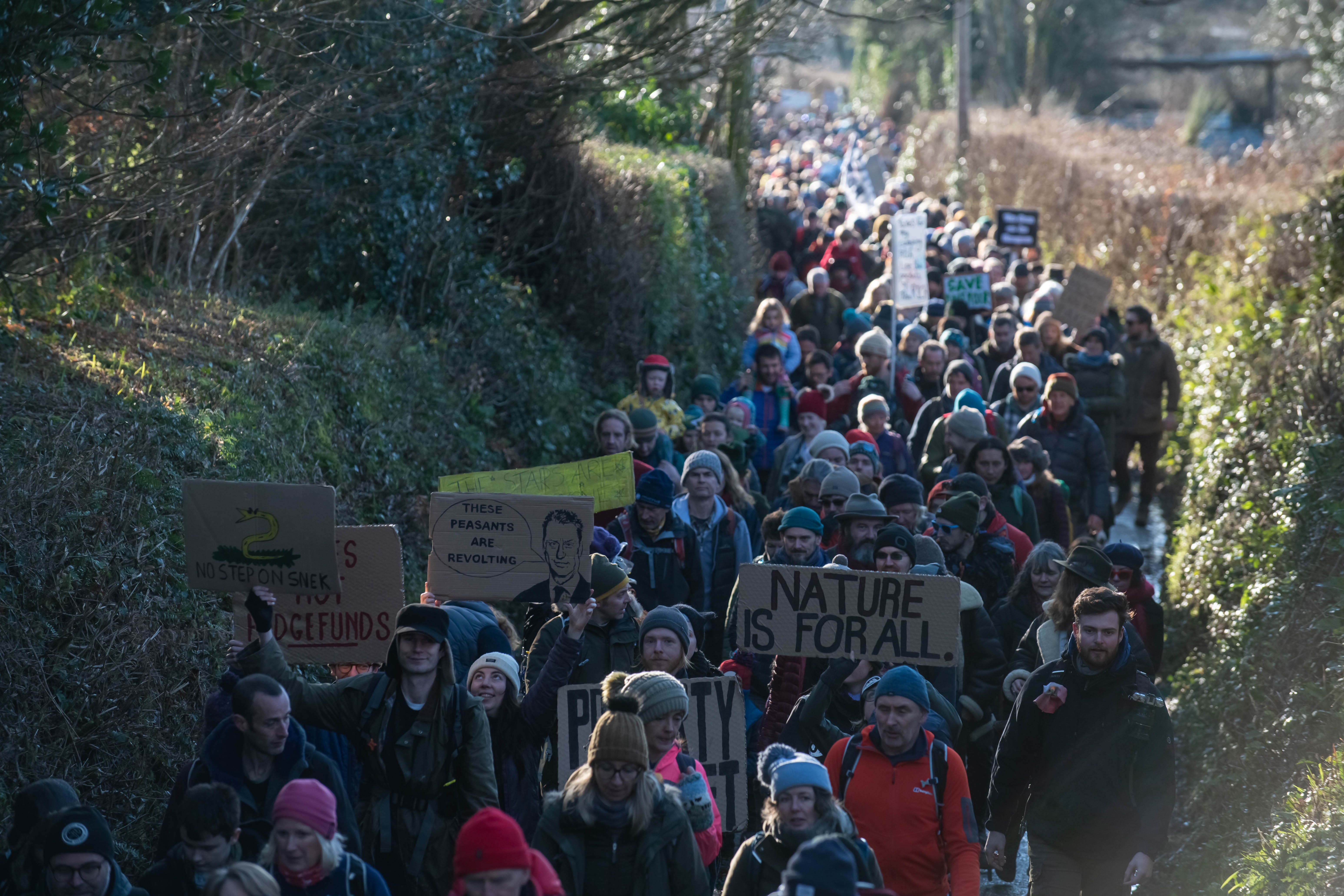 Protestors walk up to Stall Mall at Dartmoor National Park on January 21, 2023 in Cornwood, England.