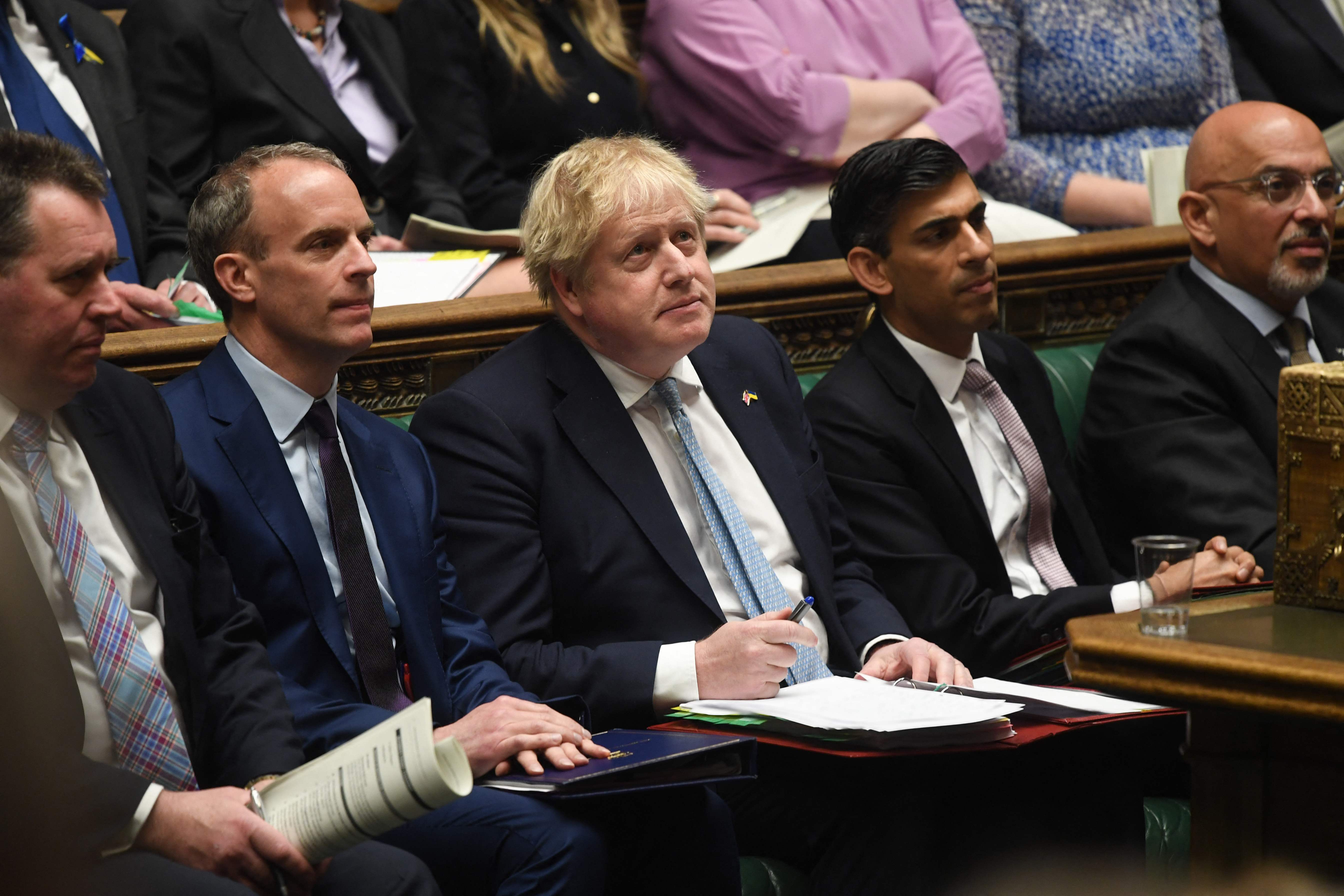 On the front bench in March 2022, alongside the man who was later to sack him