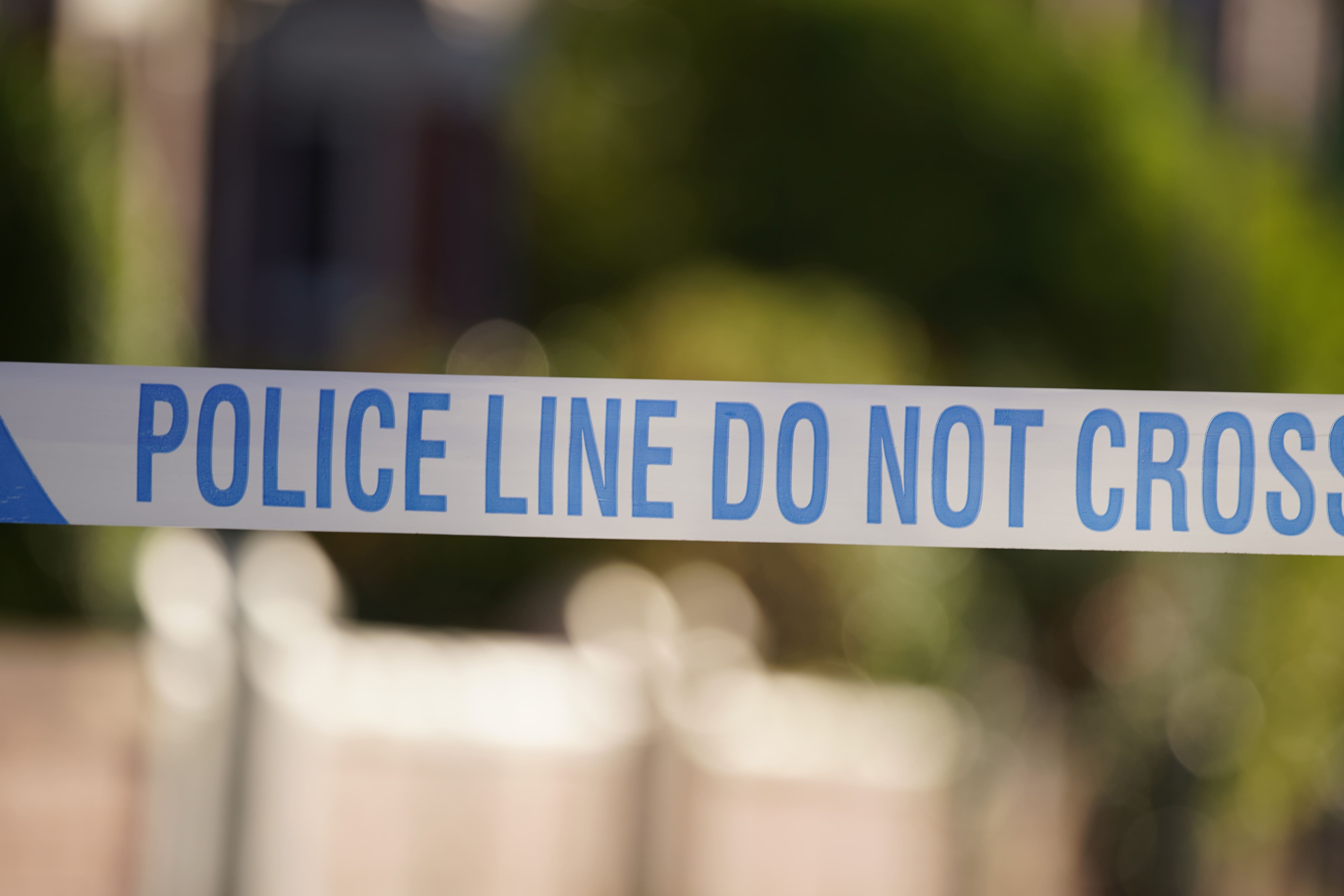 Stock image of police tape near a scene of a suspected crime (Peter Byrne/PA)