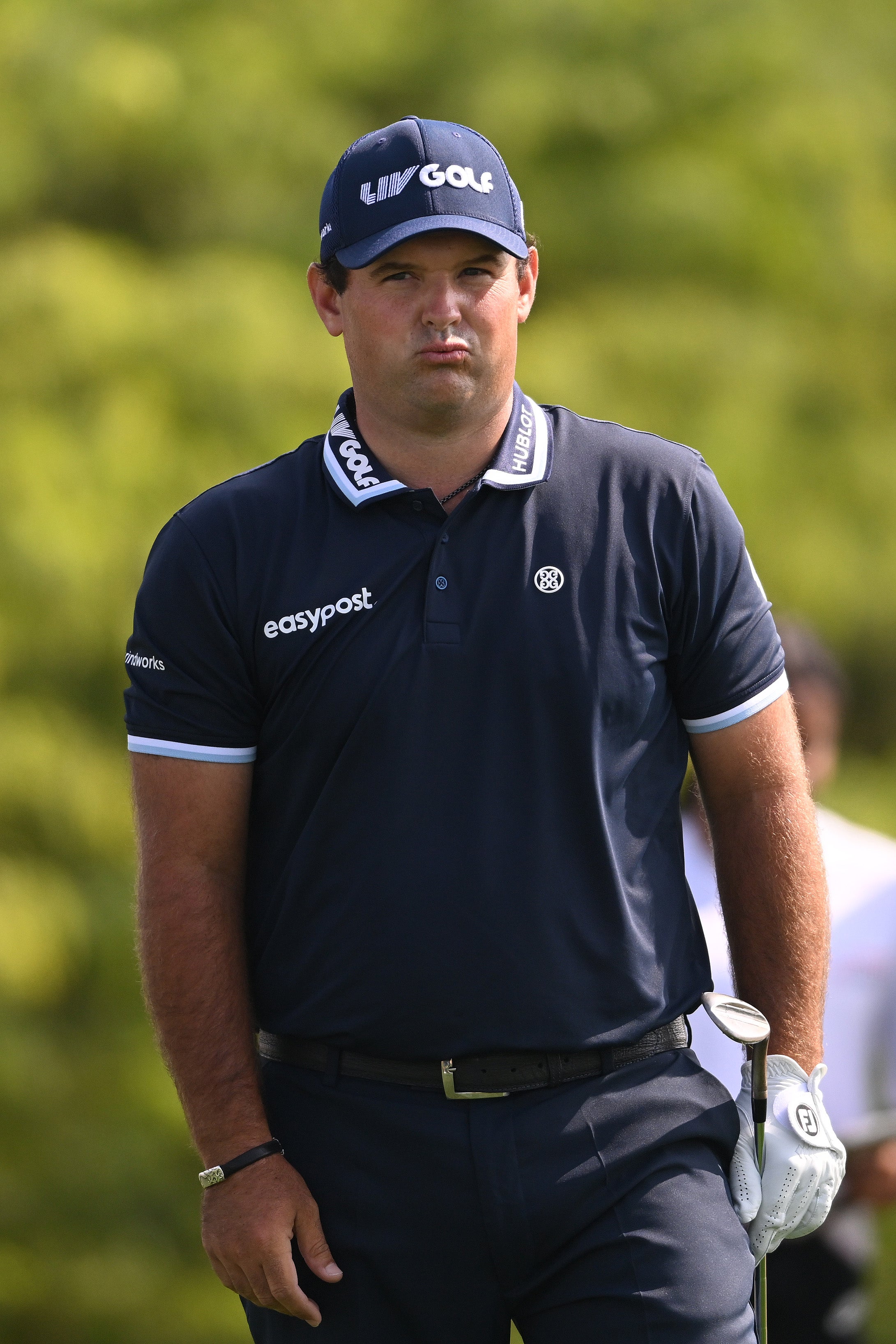 Patrick Reed of The United States reacts after chipping on the 8th hole