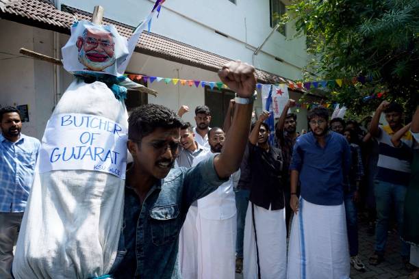 In this picture taken on 25 January 2023, Kerala Students’ Union activists shout slogans with an effigy of India’s prime minister Narendra Modi after watching the BBC documentary ‘India: The Modi Question’, at Ernakulam Law College in Kochi