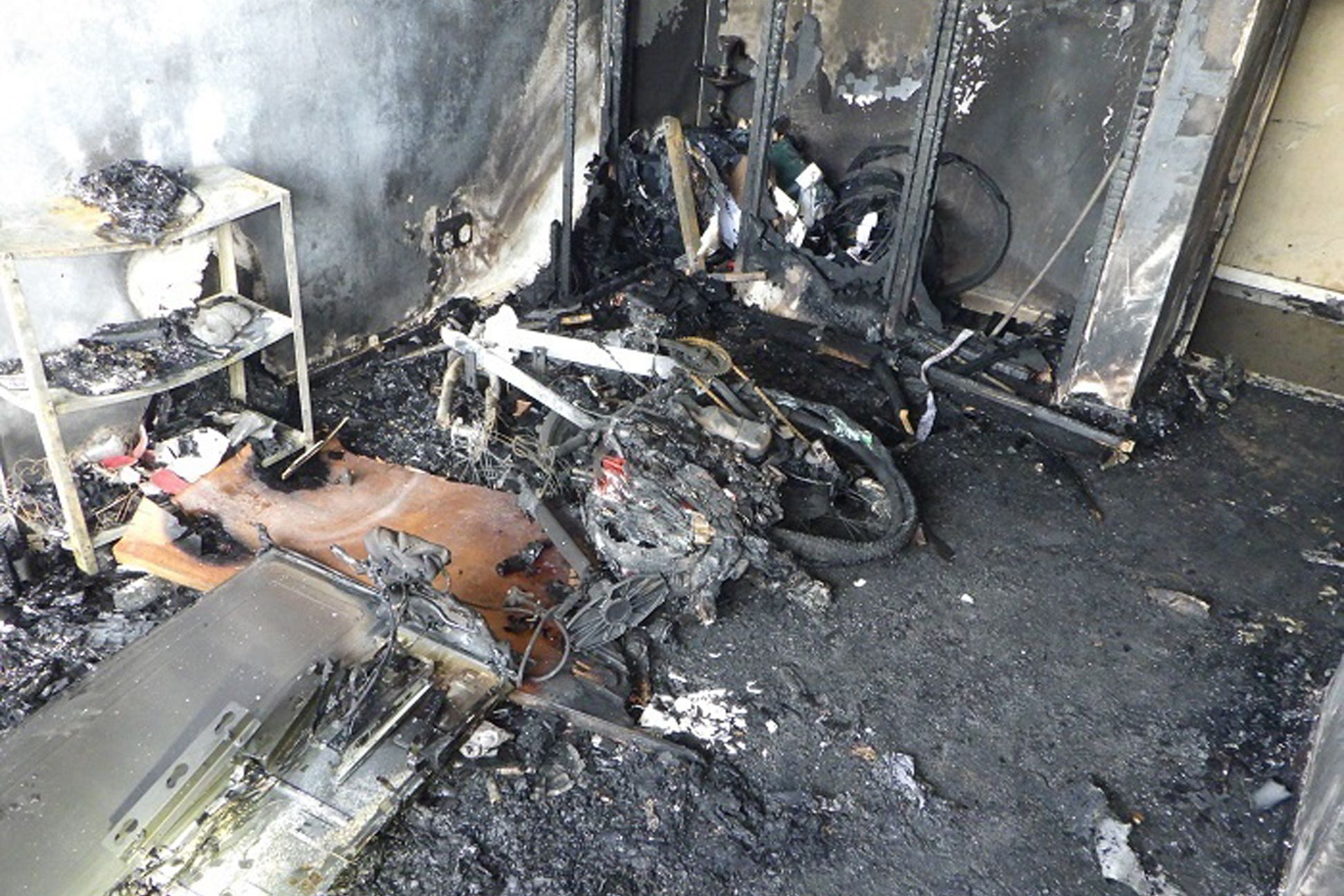 Damage caused to a flat in Shepherds Bush after a fire involving an e-bike in June last year