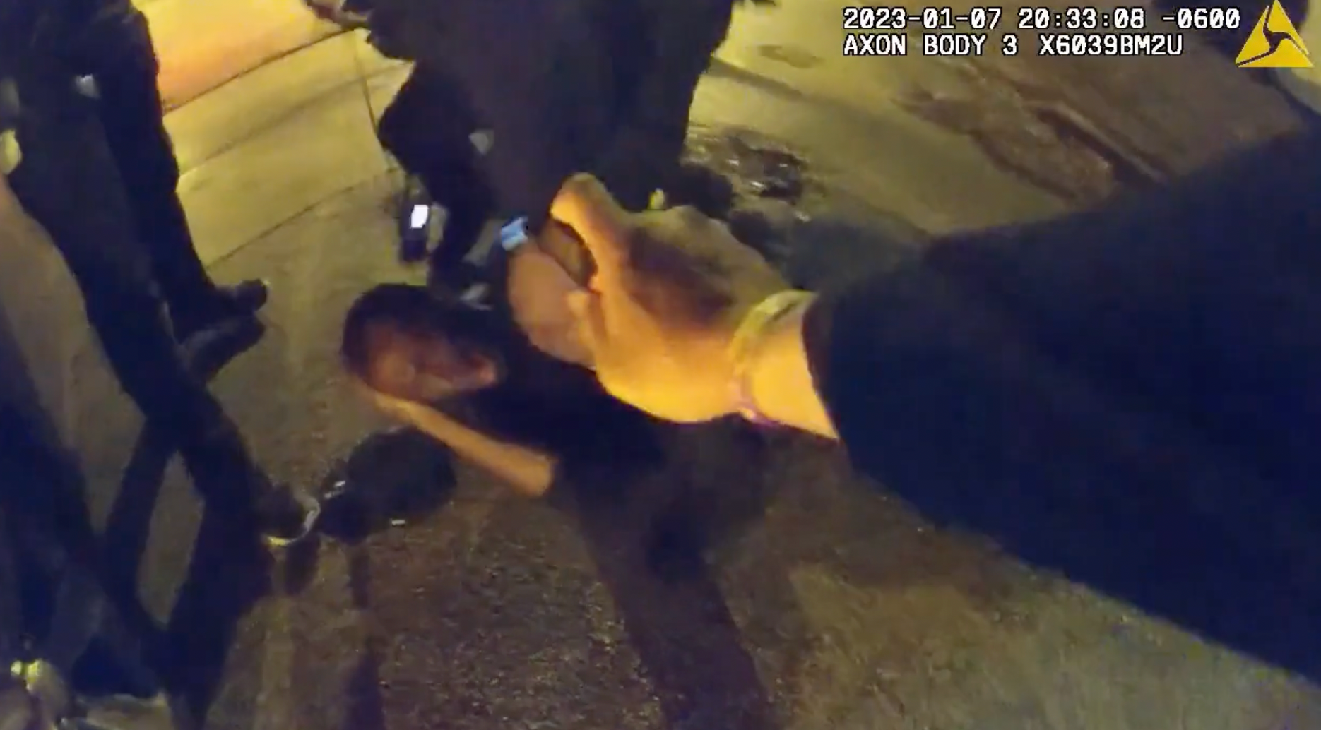 An Memphis Police Department officer pepper sprays Tyre Nichols in the face