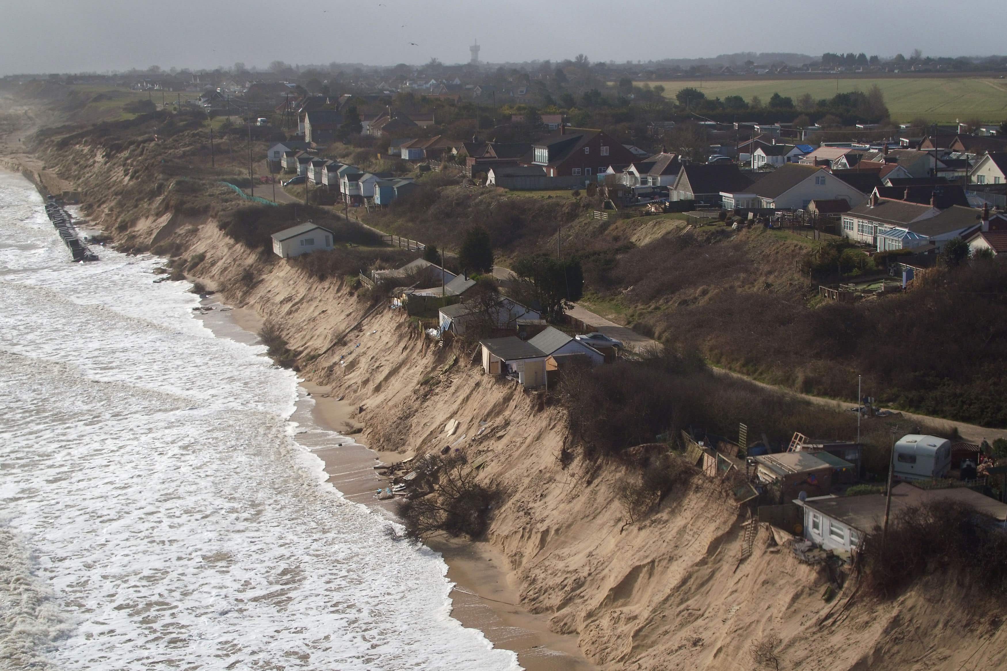 Houses sit on the cliff edge in Hemsby, Norfolk (Joe Giddens/ PA)