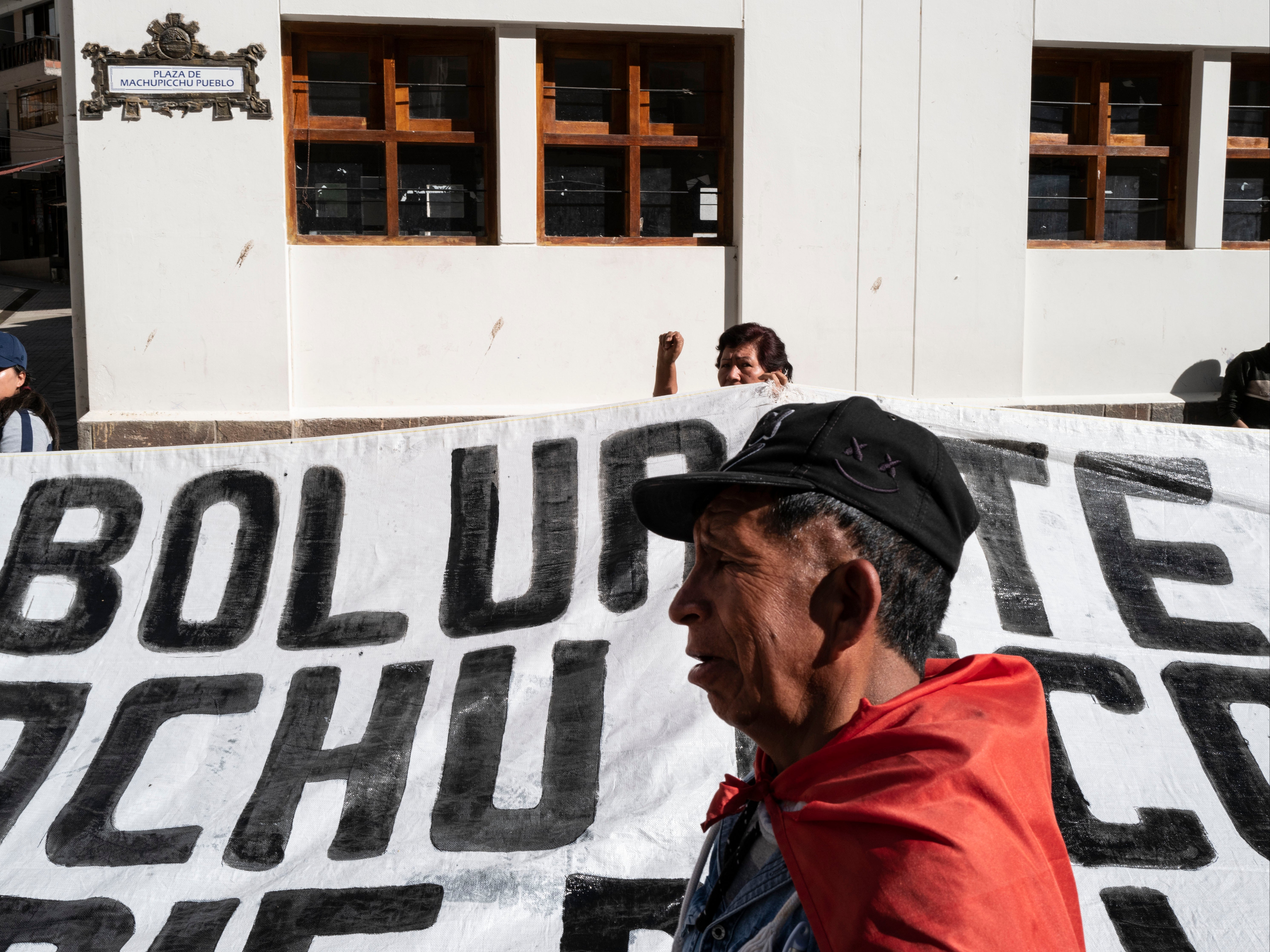 Residents and demonstrators protesting against the Peruvian government march through the town’s main plaza